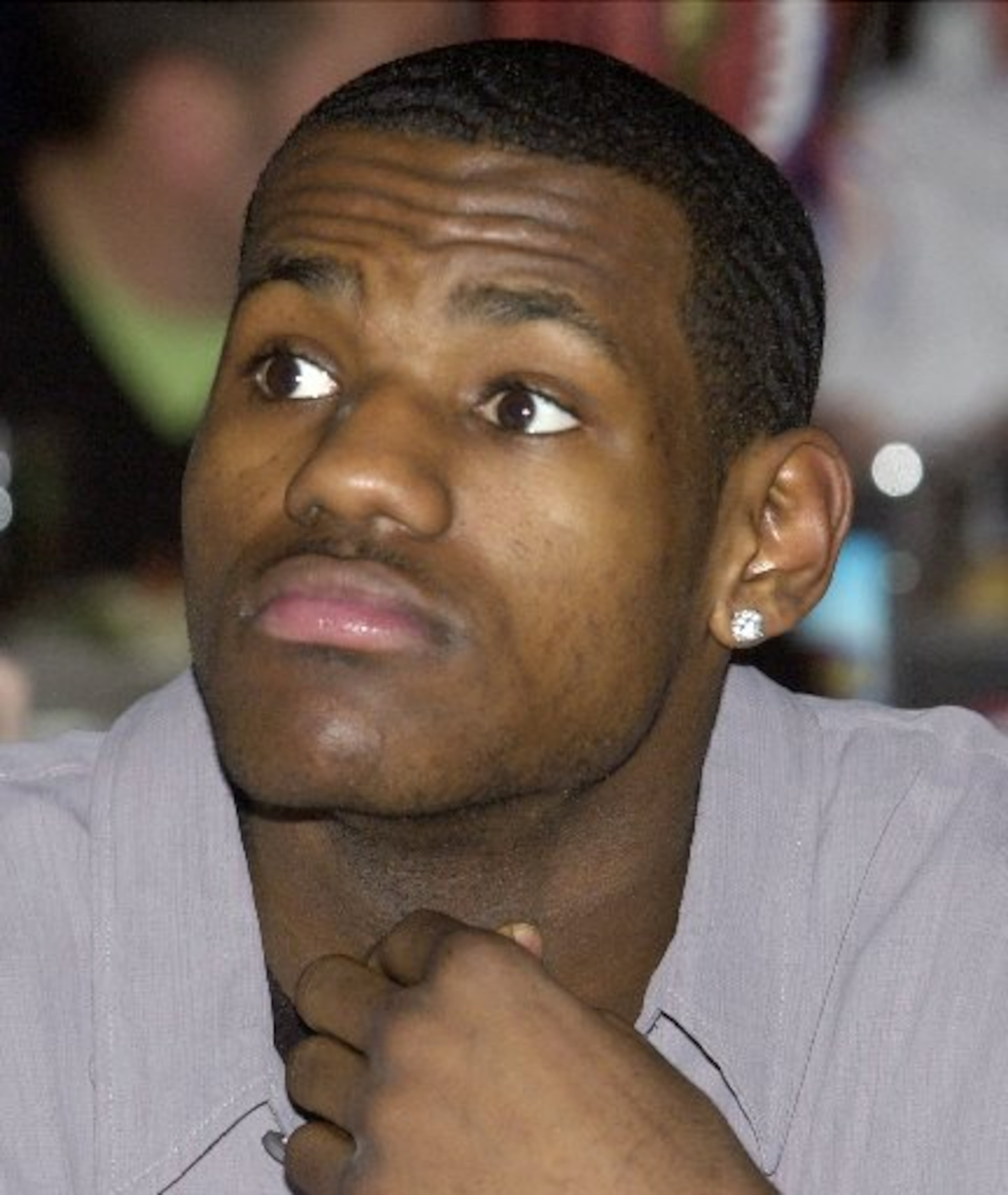 High school basketball star LeBron James relaxes at his table before the greater Cleveland Sports Awards Thursday, Jan. 30, 2003, in Cleveland.