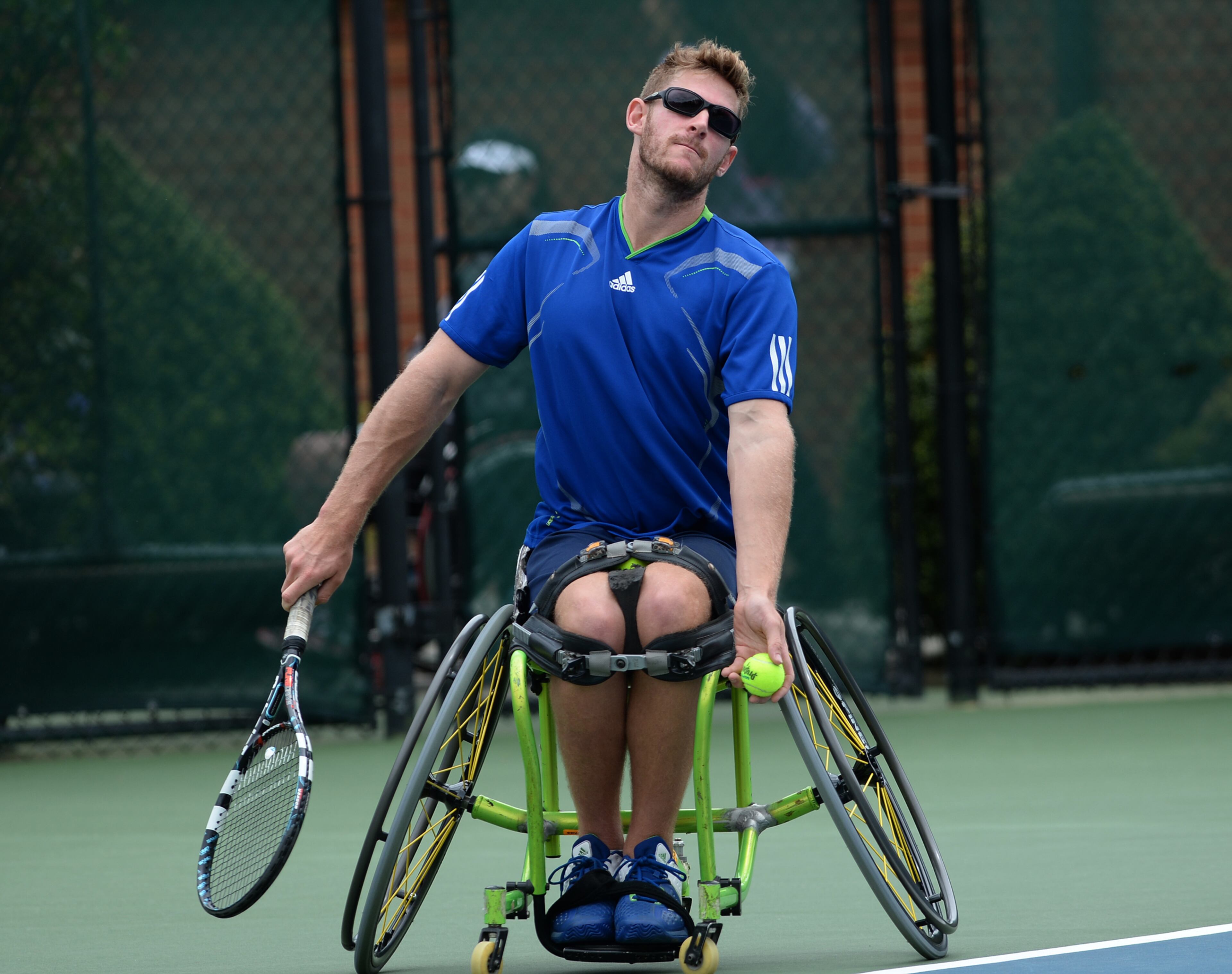 Ben Weekes, Australia, starts his serving motion during the Atlanta Open Wheelchair Tennis Championships at the Dunwoody Country Club on Wednesday, May 1, 2013. He won his match against Ji-Hwan Lee, South Korea. JOHNNY CRAWFORD / JCRAWFORD@AJC.COM