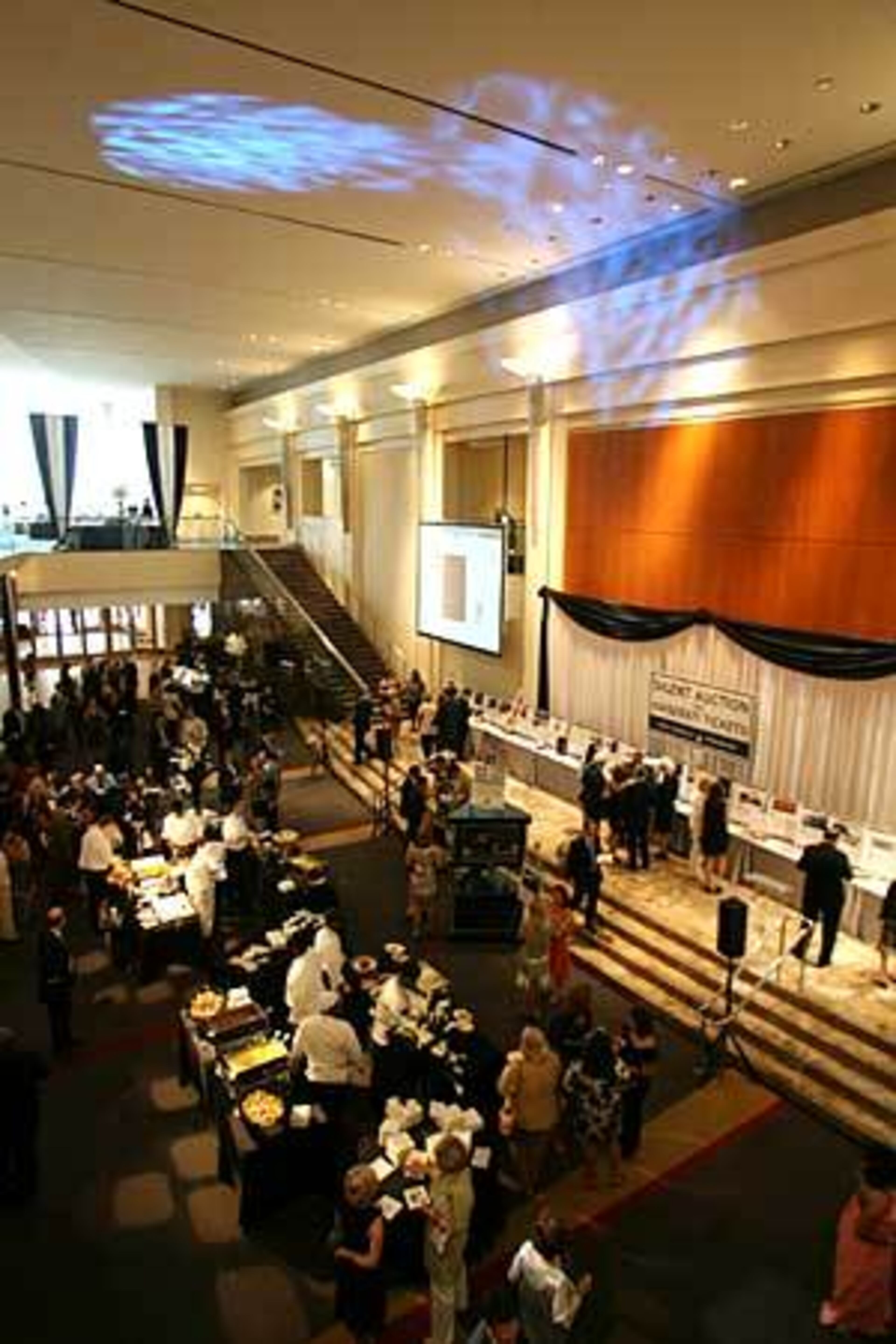 Guests eat, drink and look at silent auction items during the G-CAPP fundraising event.