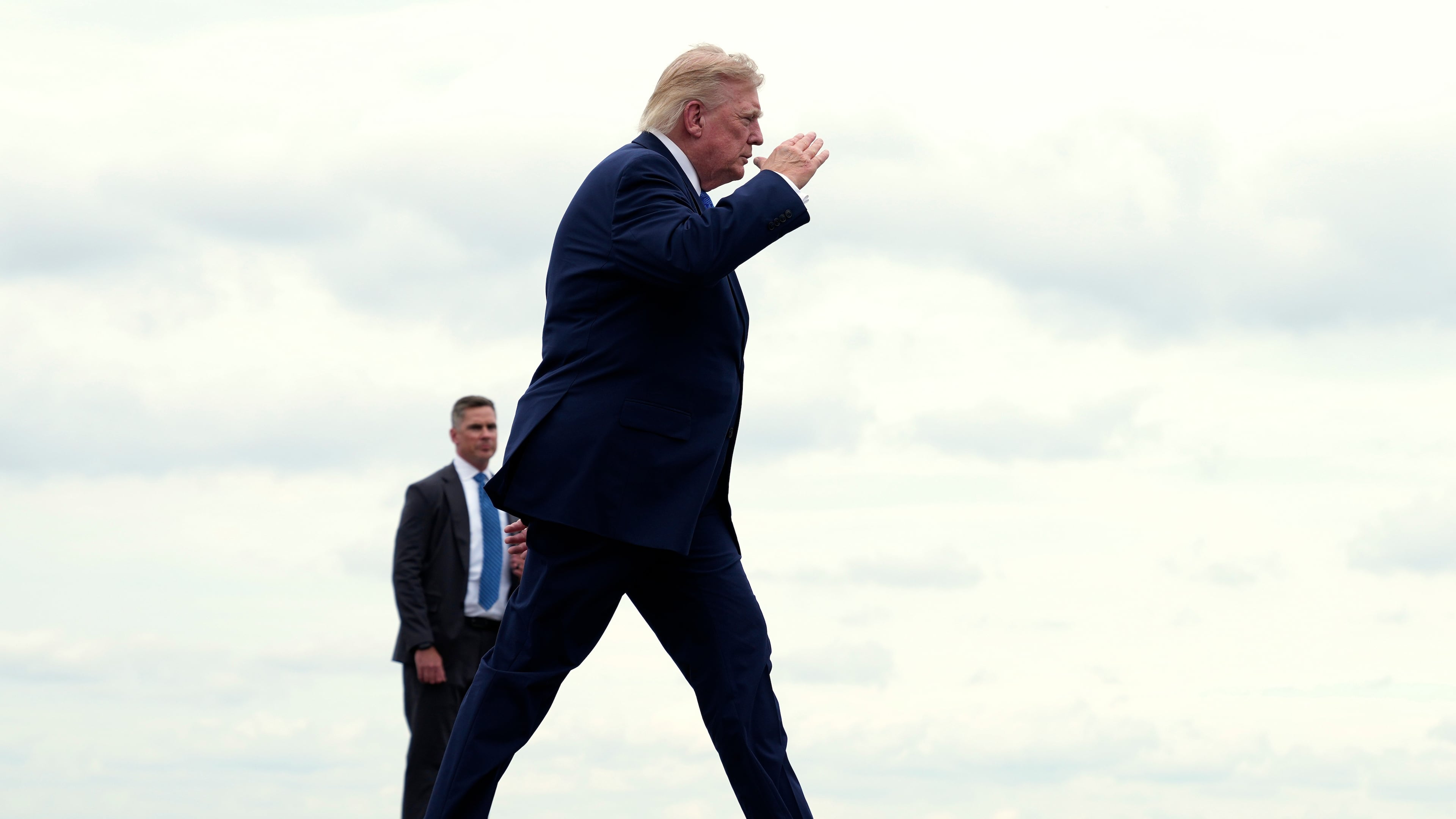 President Donald Trump walks to board Air Force One at Morristown Municipal Airport, in Morristown, N.J., Sunday, Aug. 2, 2026, en route to return to Washington. (AP Photo/Jacquelyn Martin)