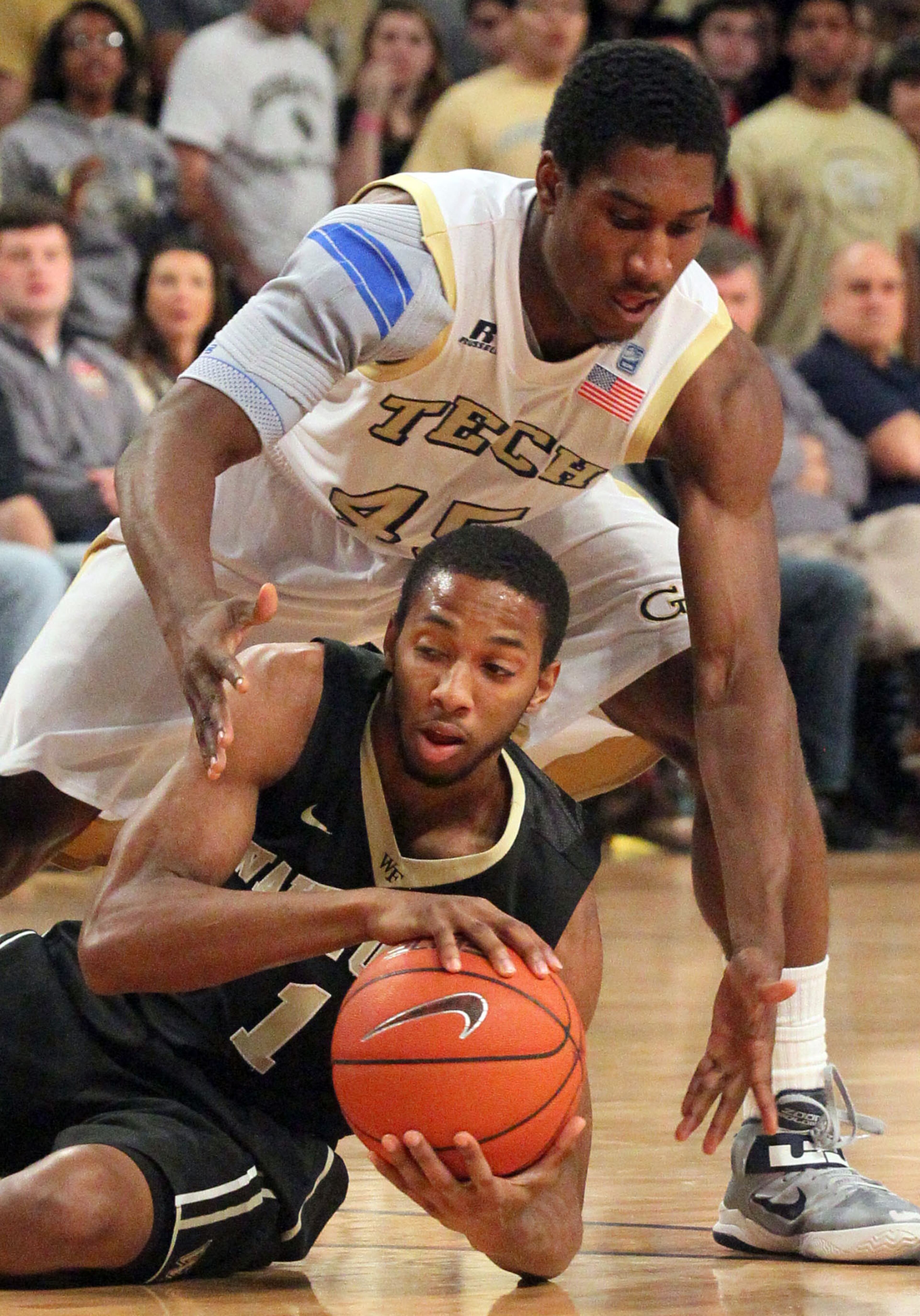 Georgia Tech's Solomon Poole tries to get the ball from Wake Forest's Madison Jones during second-half action.