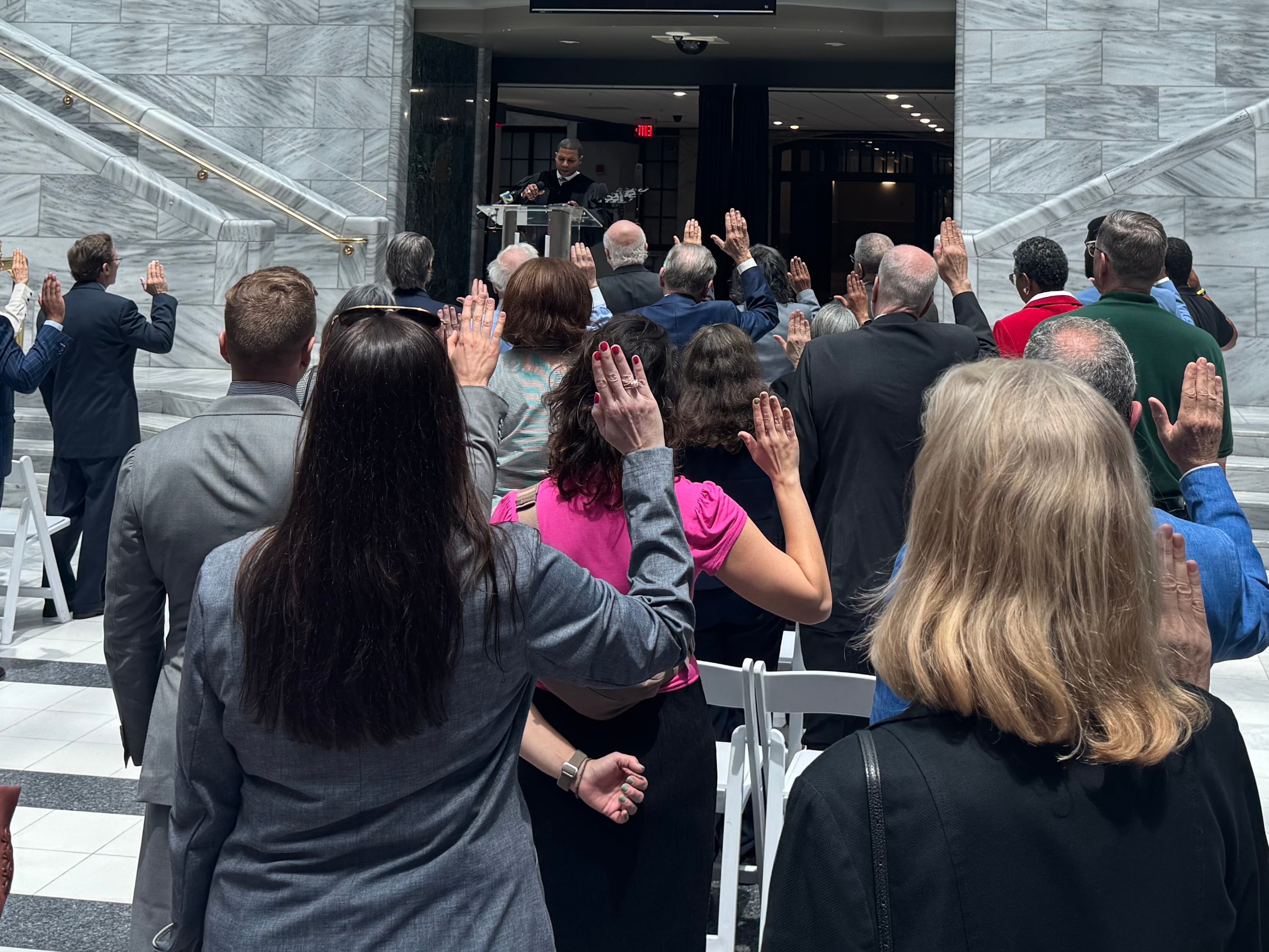 Lawyers reaffirm their oaths to the U.S. and Georgia Constitutions during a protest at Atlanta City Hall on Thursday.