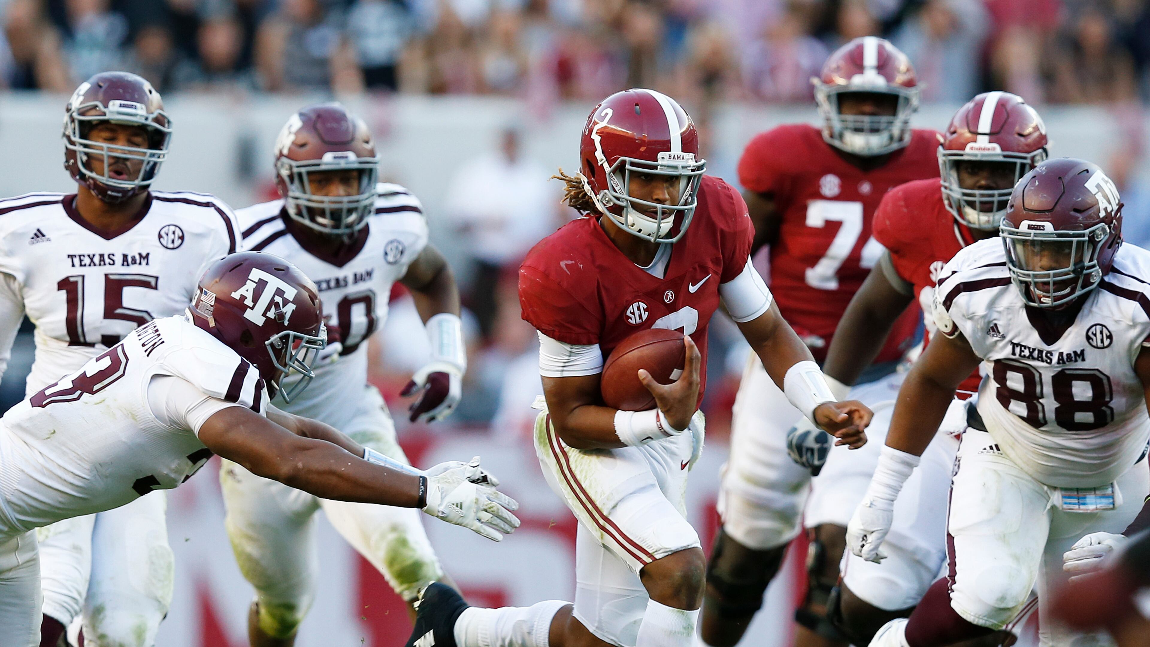 Alabama quarterback Jalen Hurts outruns Texas A&M for a touchdown Saturday. (AP Photo/Brynn Anderson)