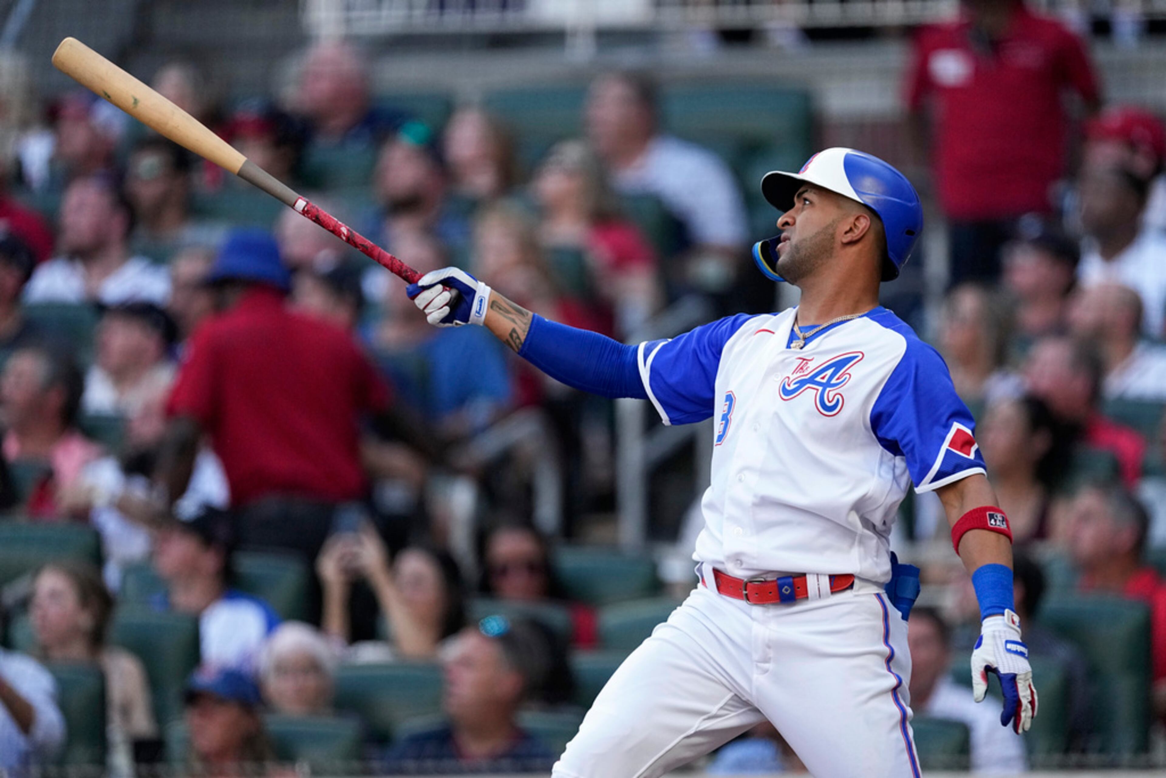 Atlanta Braves' Eddie Rosario watches his two-run home run against the Milwaukee Brewers during the first inning of a baseball game Saturday, July 29, 2023, in Atlanta. (AP Photo/John Bazemore)