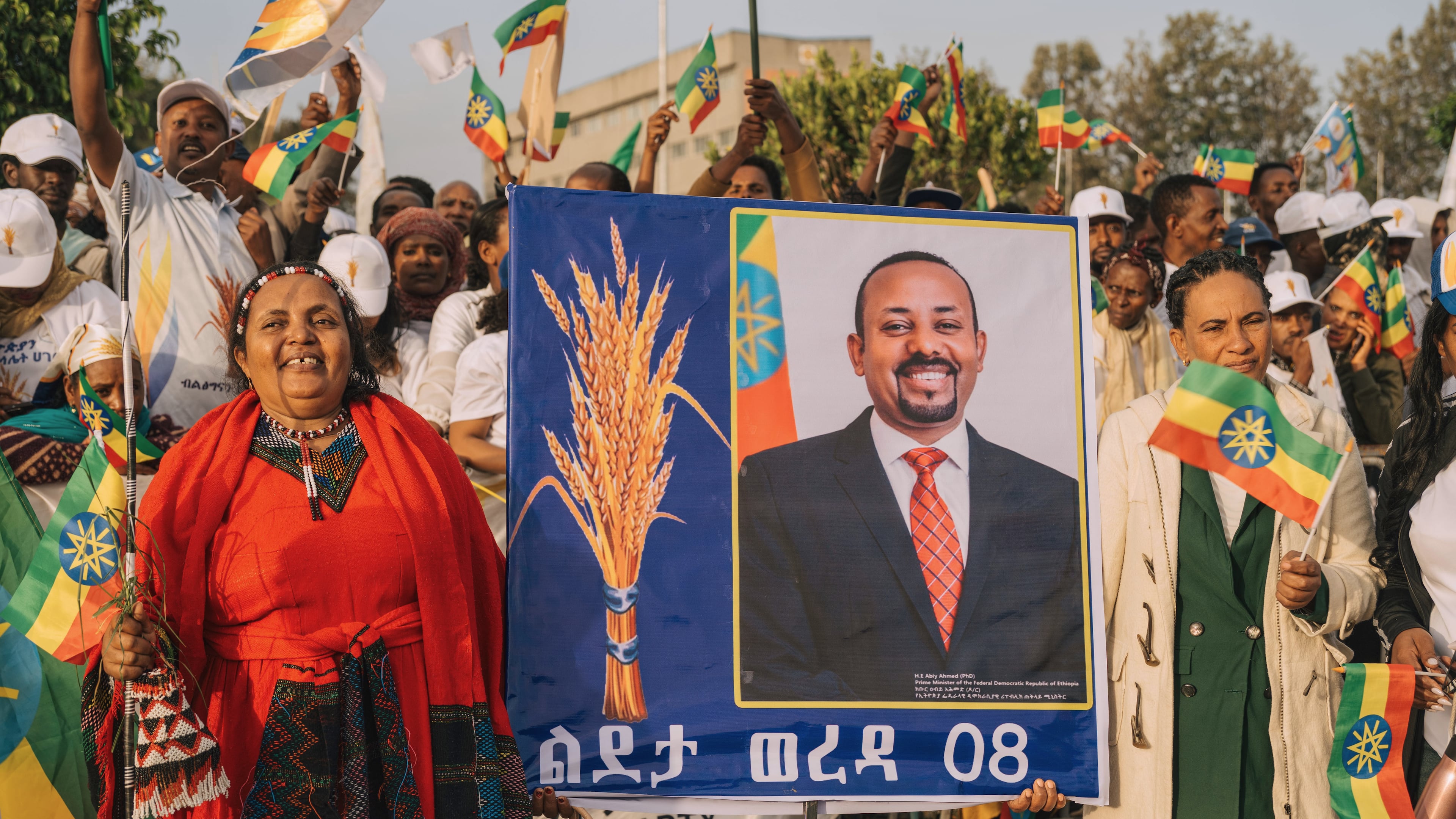 Supporters of Ethiopia's ruling party hold a large portrait of Prime Minister Abiy Ahmed at a rally ahead of the national elections in Addis Ababa, Ethiopia, Tuesday, May 26, 2026. (AP Photo/Amanuel Sileshi)