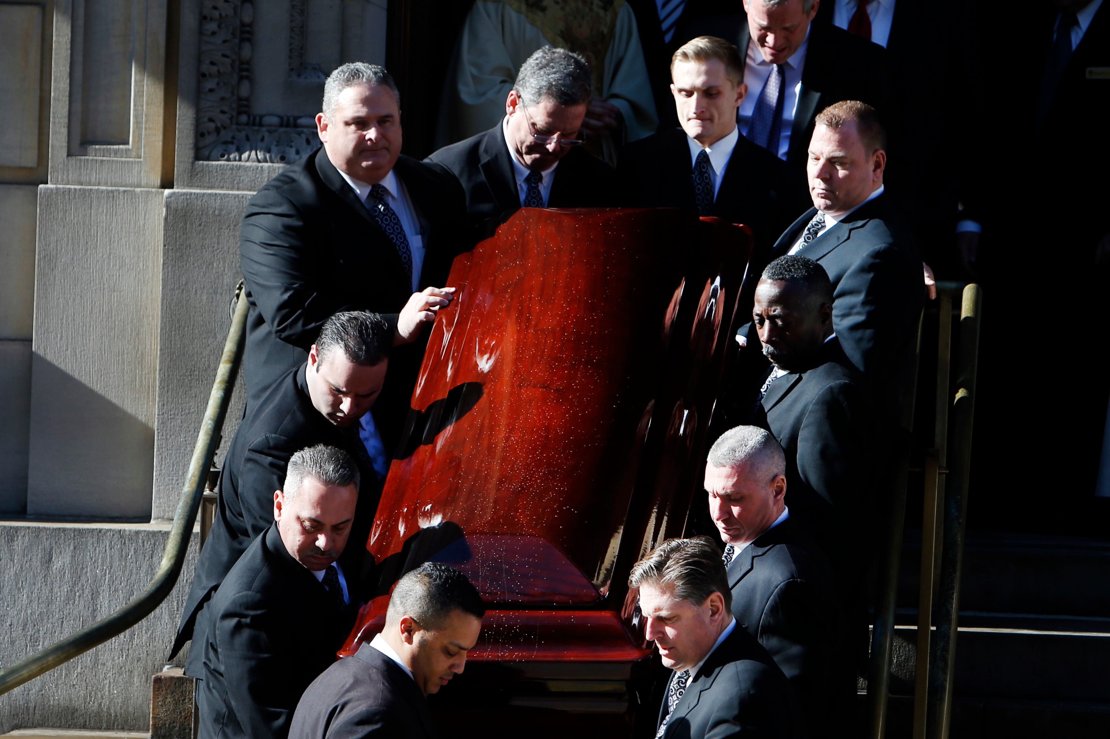 A casket bearing the remains of Philip Seymour Hoffman is carried out of St. Ingatius Loyola church after the actor's funeral Friday, Feb. 7, 2014, in New York. Hoffman, 46, was found dead Sunday of an apparent heroin overdose. (AP Photo/Jason DeCrow)