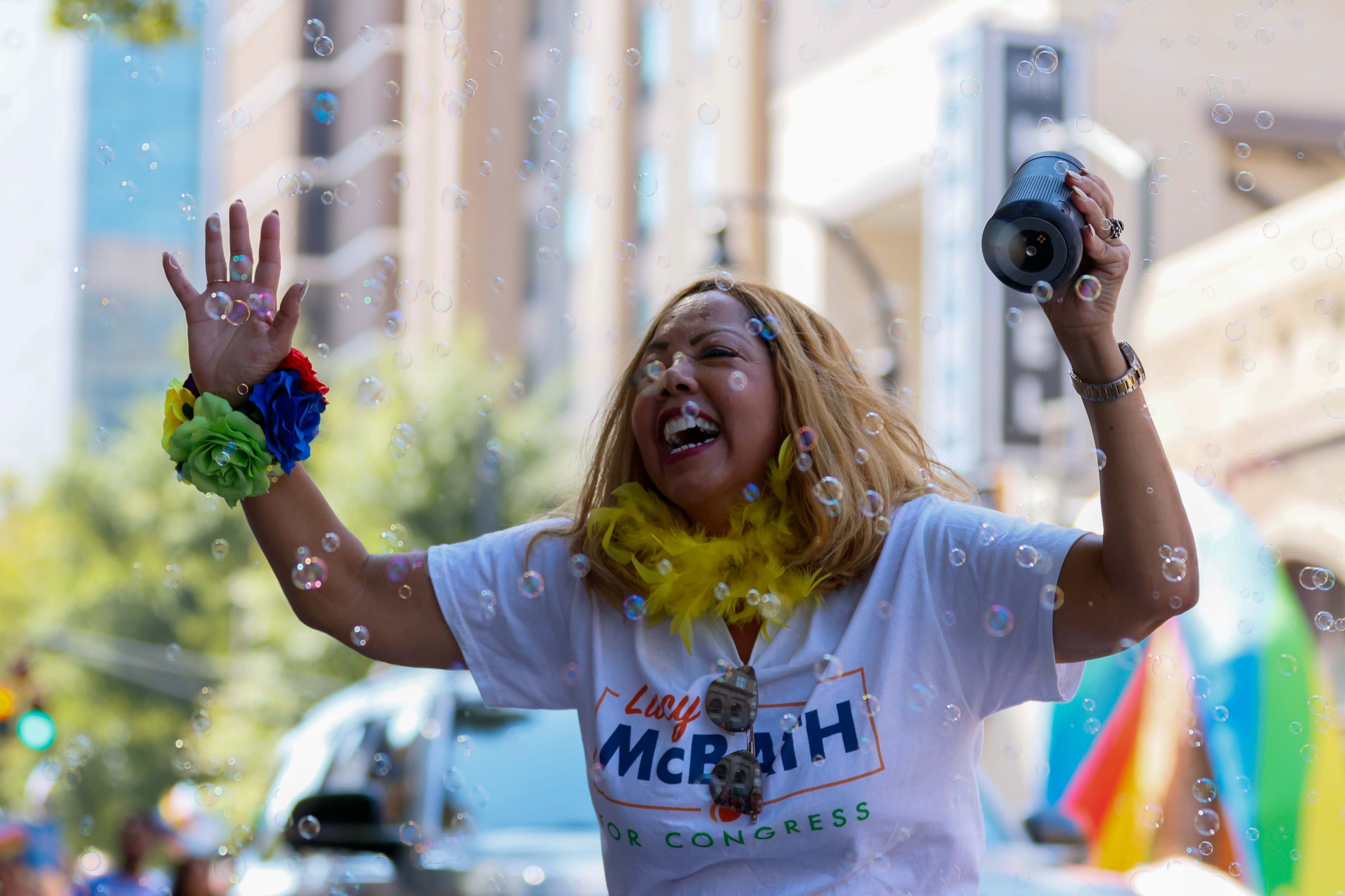 U.S. Rep. Lucy McBath, D-Marietta, waves parade goers as she enjoys during the annual Pride Parade in Atlanta on Sunday, Oct. 13, 2024.
(Miguel Martinez / AJC)