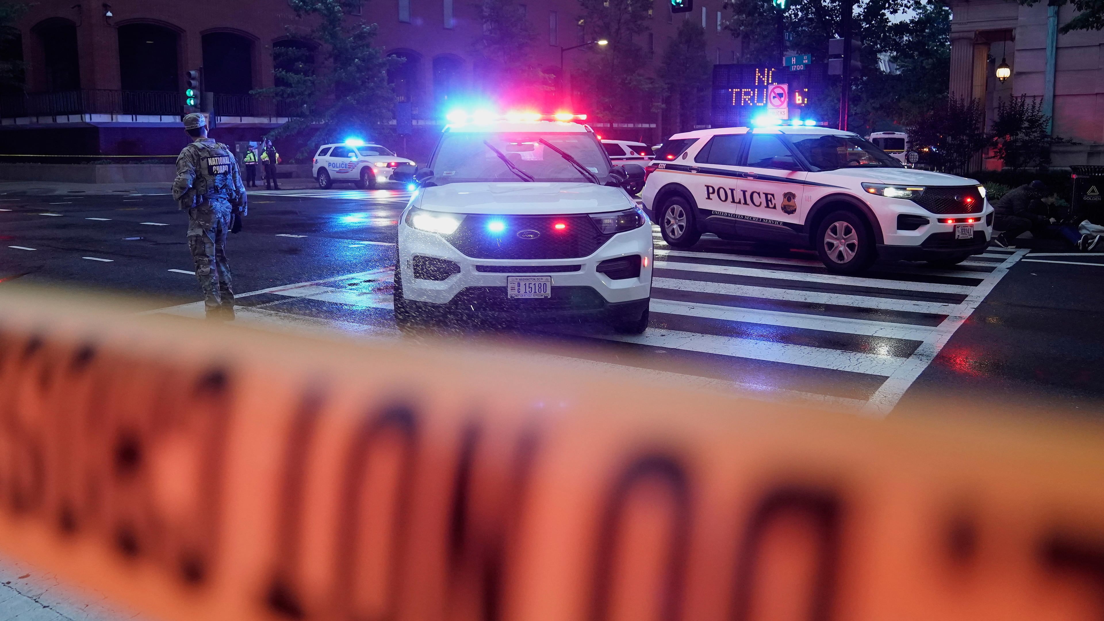 U.S. Secret Service Police are seen on a crime scene after responding to reports of shots fired near the White House, Saturday, May 23, 2026, in Washington. (AP Photo/Jose Luis Magana)