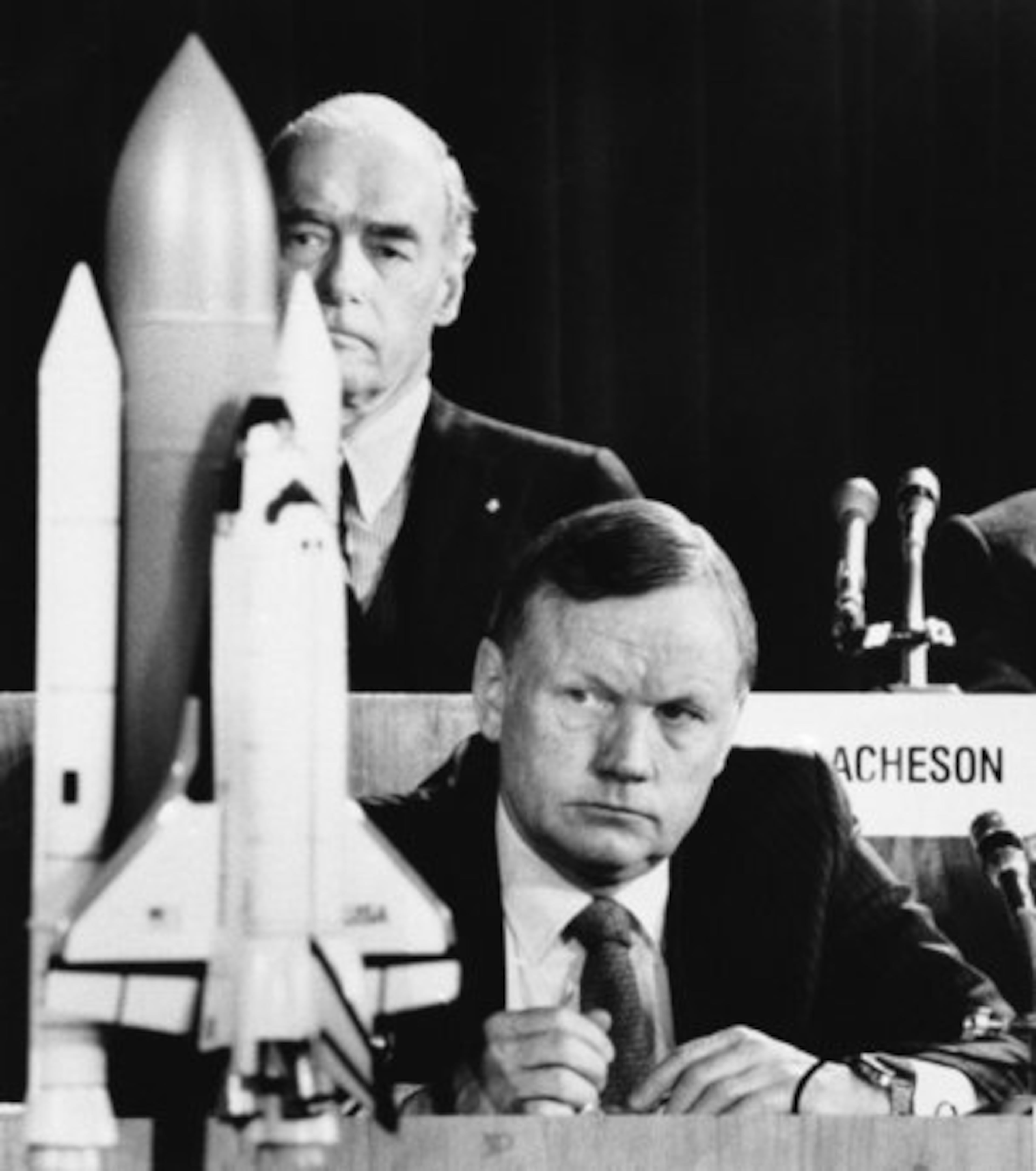 In this Feb. 11, 1986 hoto, former astronaut Neil Armstrong, a member of the presidential panel investigating the Space Shuttle Challenger explosion, listens to testimony before the commission in Washington, David Acheson, a commission member, listens in the background.