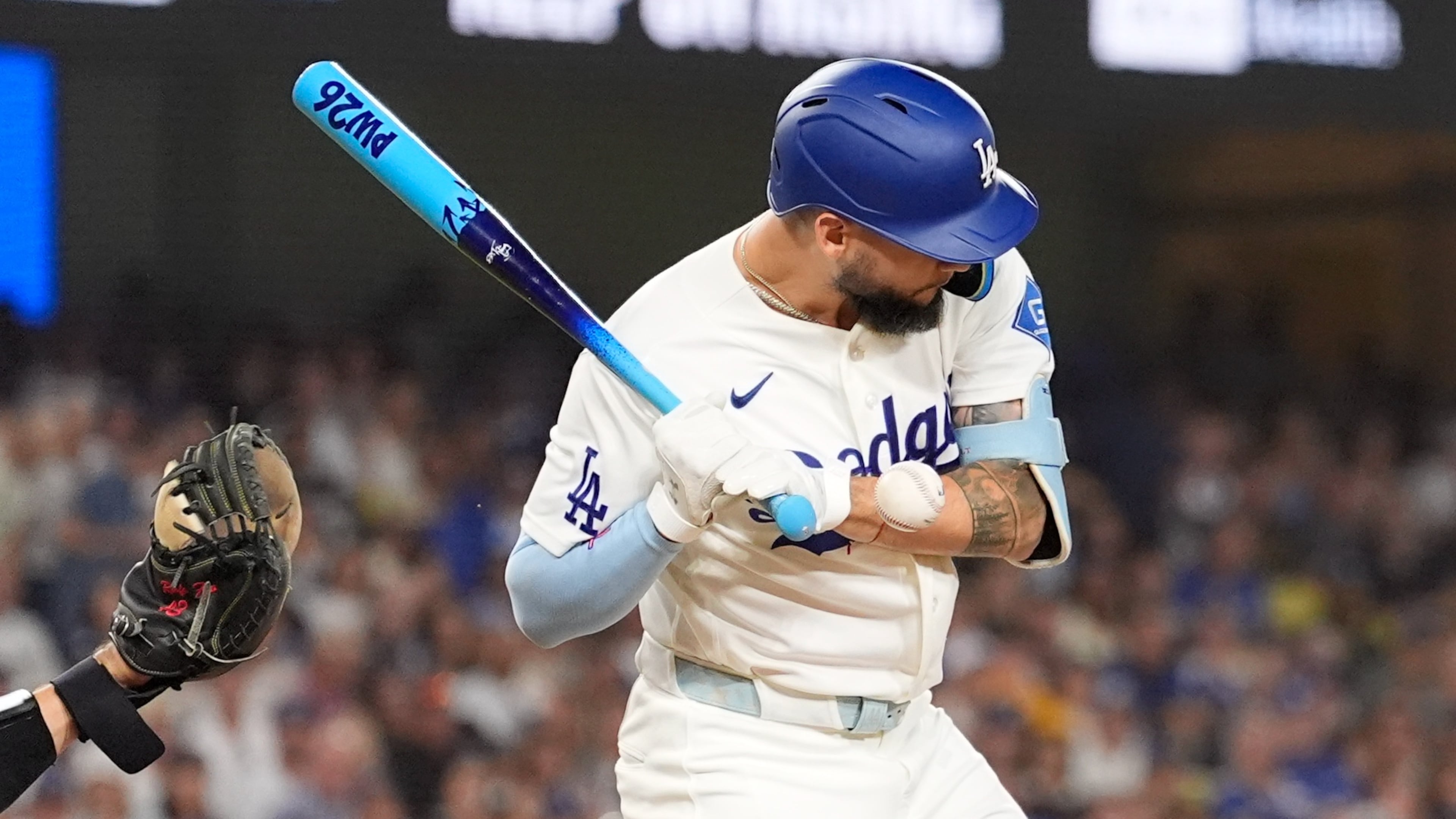 Los Angeles Dodgers' Andy Pages is hit in the hand by a pitch during the third inning of a baseball game against the Pittsburgh Pirates, Friday, Aug. 21, 2026, in Los Angeles. (AP Photo/Mark J. Terrill)
