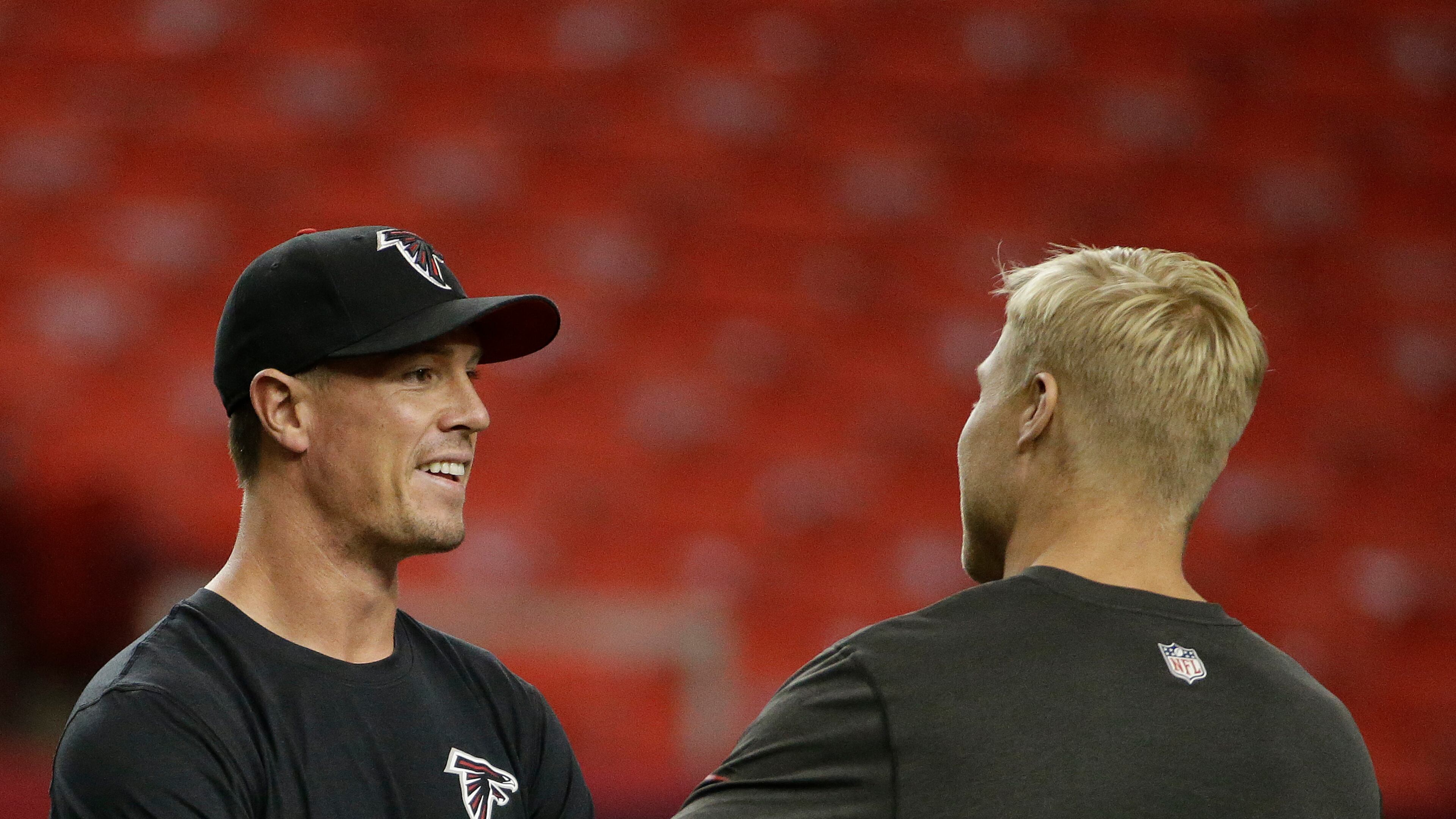 Atlanta Falcons quarterback Matt Ryan, left speaks with Tampa Bay Buccaneers quarterback Josh McCown (12) before the first half of an NFL football game, Thursday, Sept. 18, 2014, in Atlanta. (AP Photo/David Goldman) Matt Ryan and Tampa Bay's Josh McCown chat it up before tonight's game. (AP)