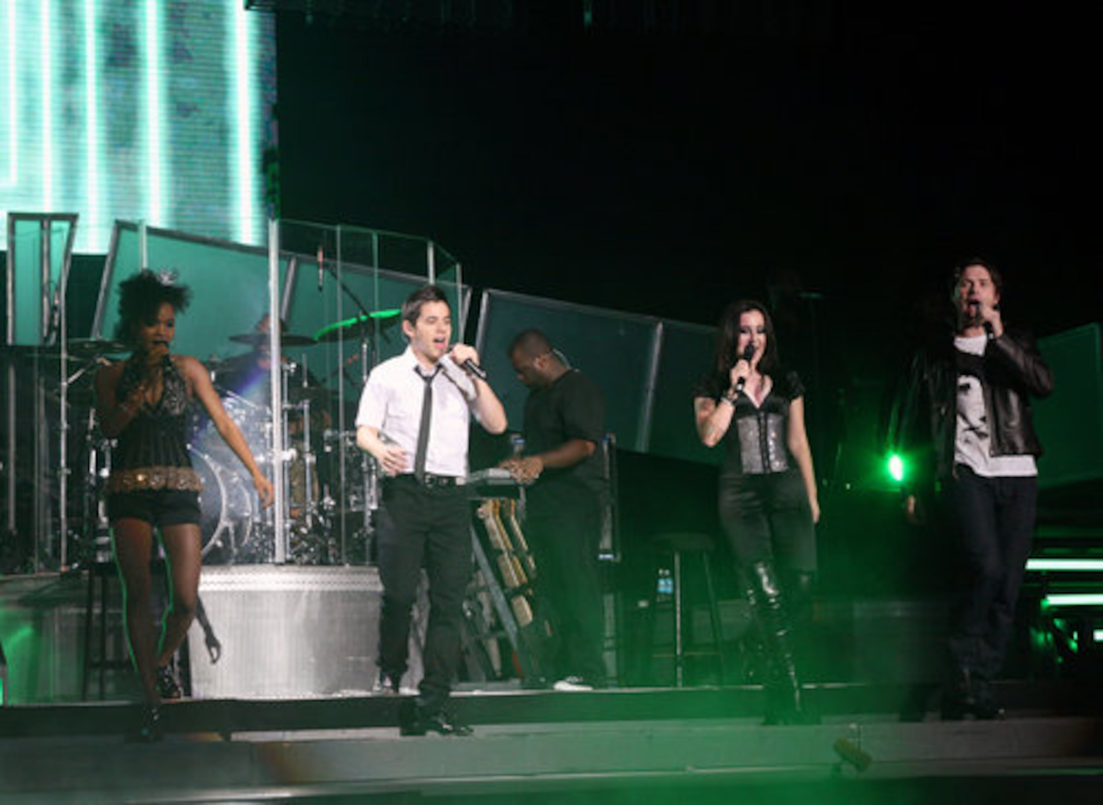 Live tour performers on stage together during the finale.