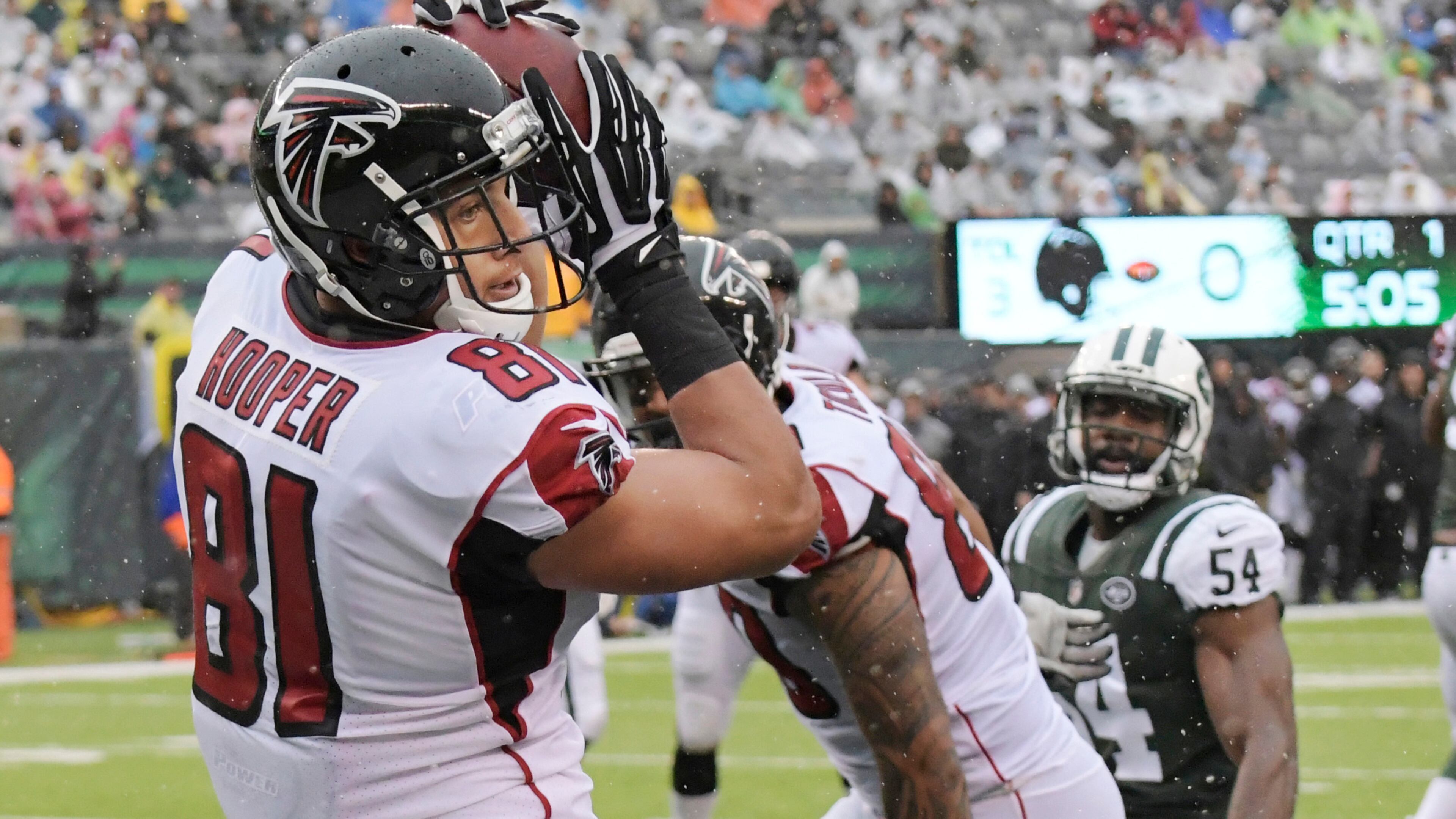 Atlanta Falcons tight end Austin Hooper (81) catches a pass in front of New York Jets outside linebacker Bruce Carter (54) during the first half of an NFL football game Sunday, Oct. 29, 2017, in East Rutherford, N.J. (AP Photo/Bill Kostroun)