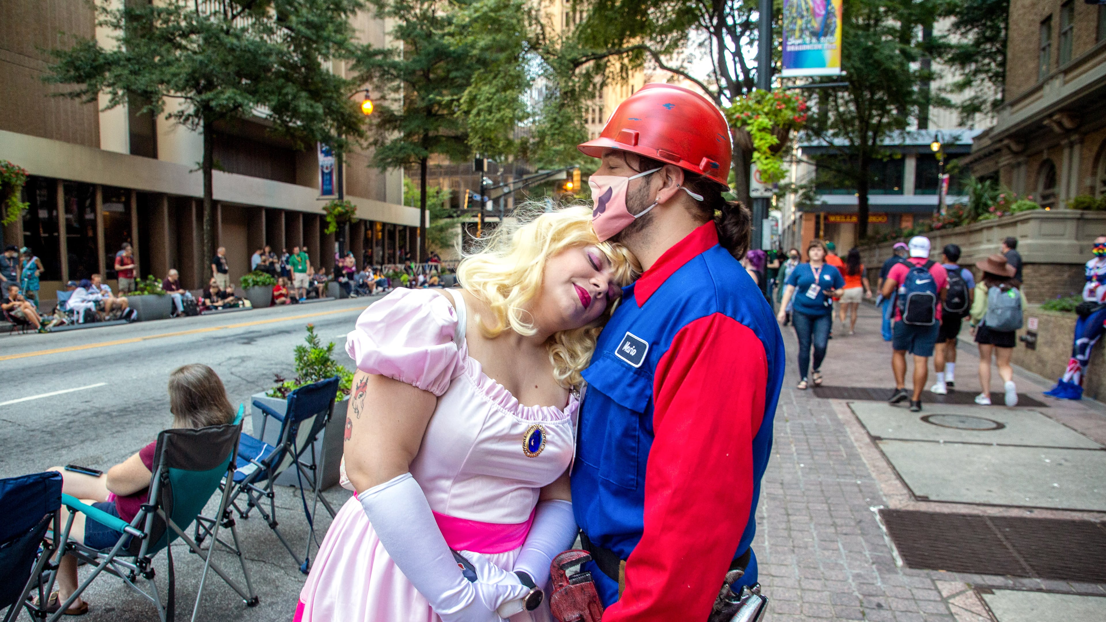 Jordan Munday and Chaz Malick wait for the start of the Dragon Con Parade on Saturday, September 4, 2021, in Atlanta. STEVE SCHAEFER FOR THE ATLANTA JOURNAL-CONSTITUTION