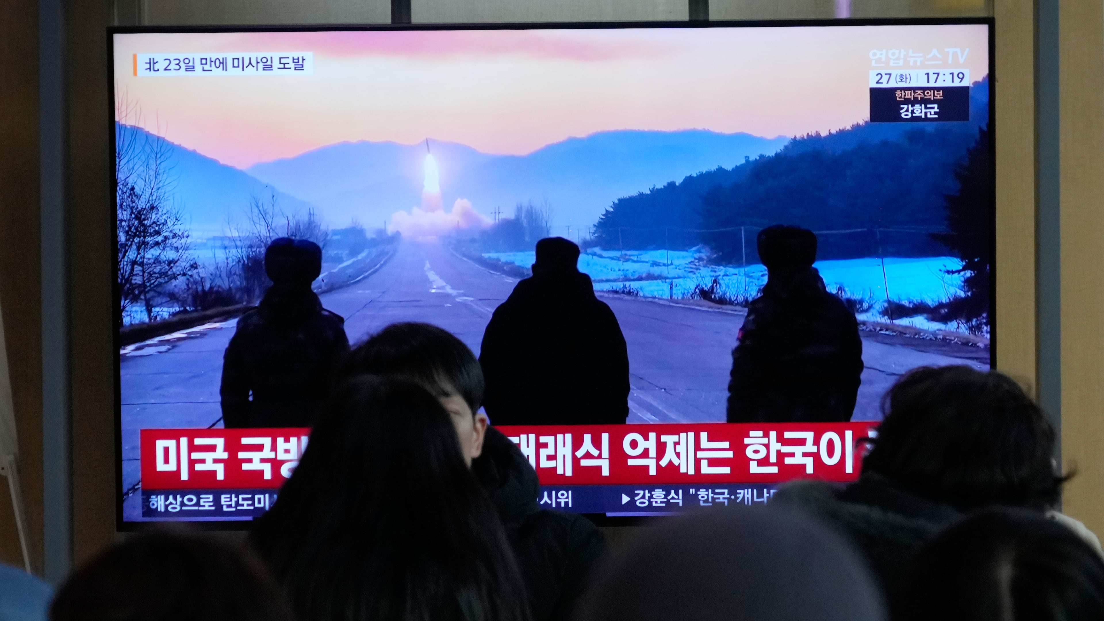 A TV screen shows a file image of North Korea's missile launch during a news program at Seoul Railway Station in Seoul, South Korea, Tuesday, Jan. 27, 2026. (AP Photo/Ahn Young-joon)