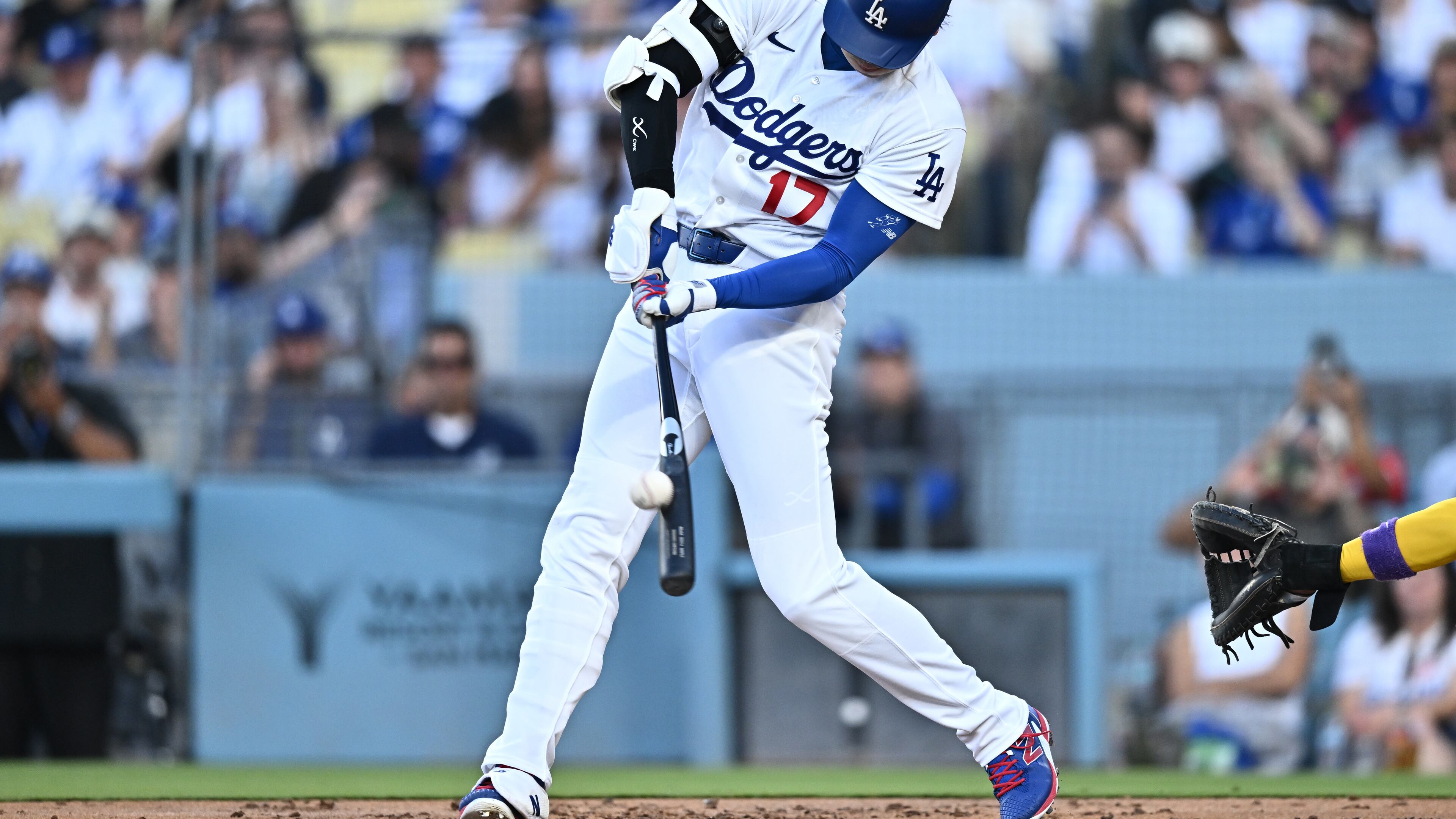 Los Angeles Dodgers' Shohei Ohtani hits a home run during the first inning of a baseball game against the Arizona Diamondbacks, Friday, July 10, 2026, in Los Angeles. (AP Photo/William Liang)