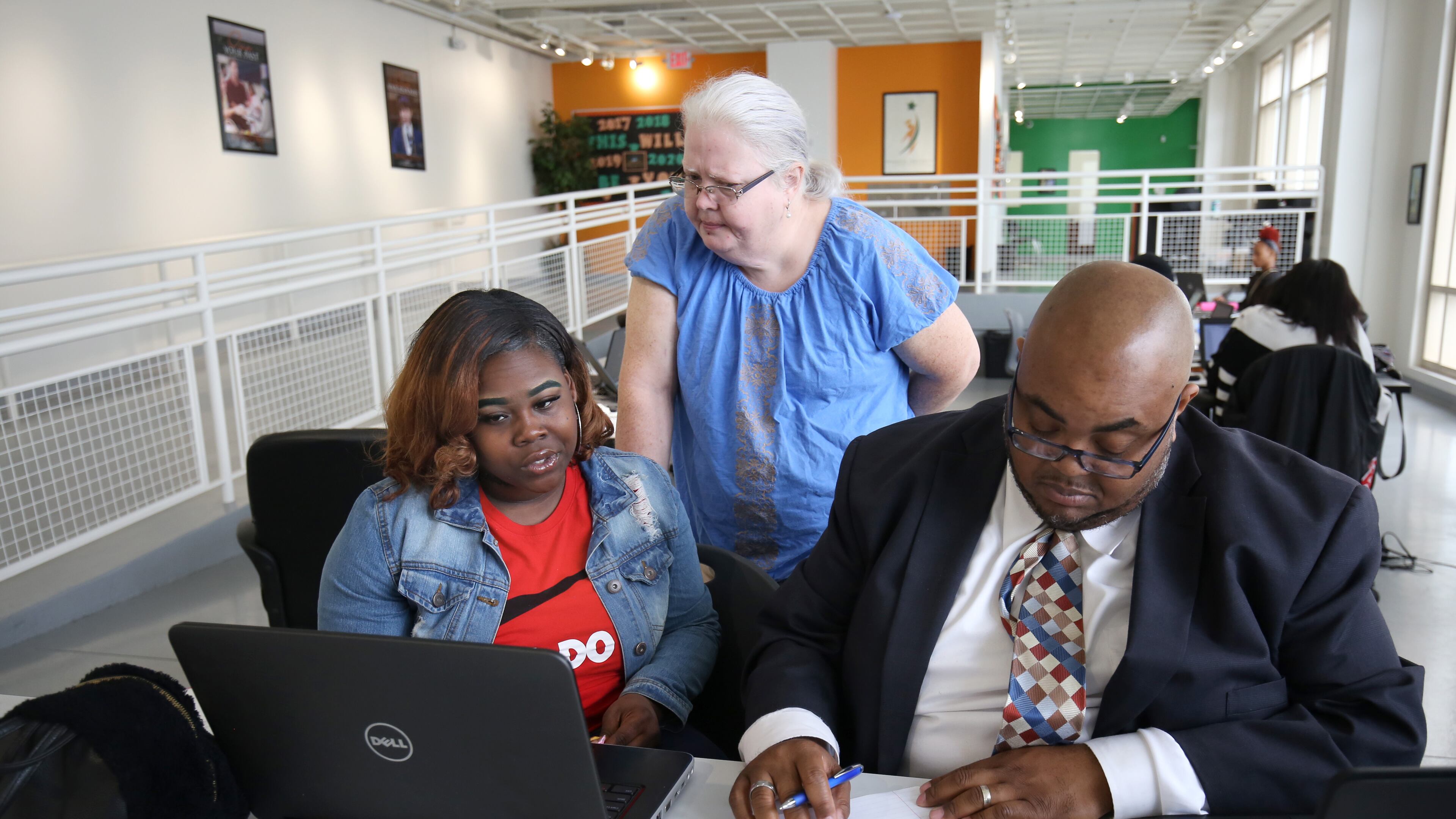 Student Destiny Glass, 18, works with special education teacher Ladonna Crowder (standing) during her study time at the Graduation Achievement Charter High School learning center Tuesday, April 22, 2018, in Atlanta. PHOTO / JASON GETZ