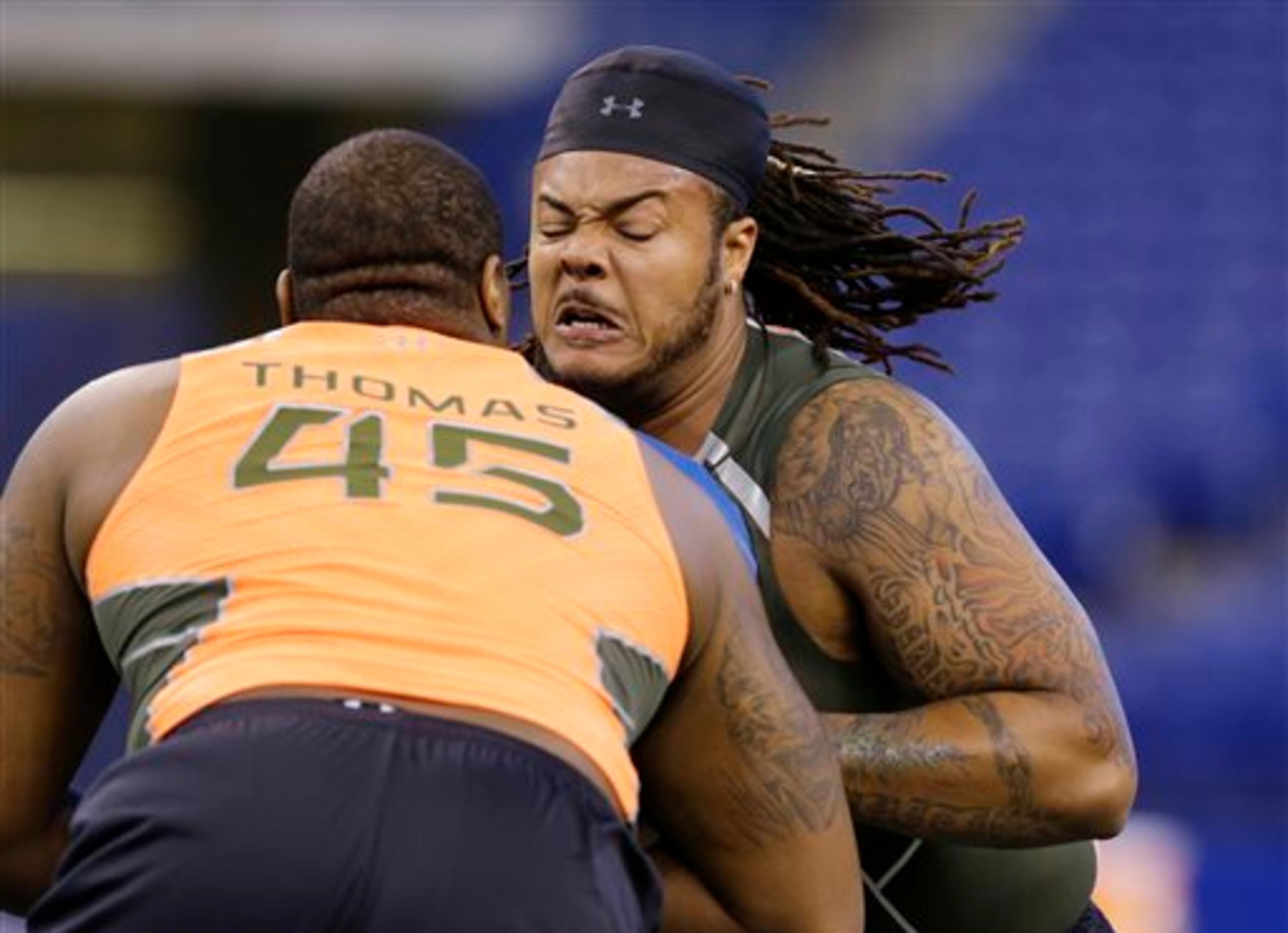 North Dakota State offensive lineman Billy Turner, right, blocks Clemson offensive lineman Brandon Thomas during a drill at the NFL football scouting combine in Indianapolis, Saturday, Feb. 22, 2014. (AP Photo/Michael Conroy)
