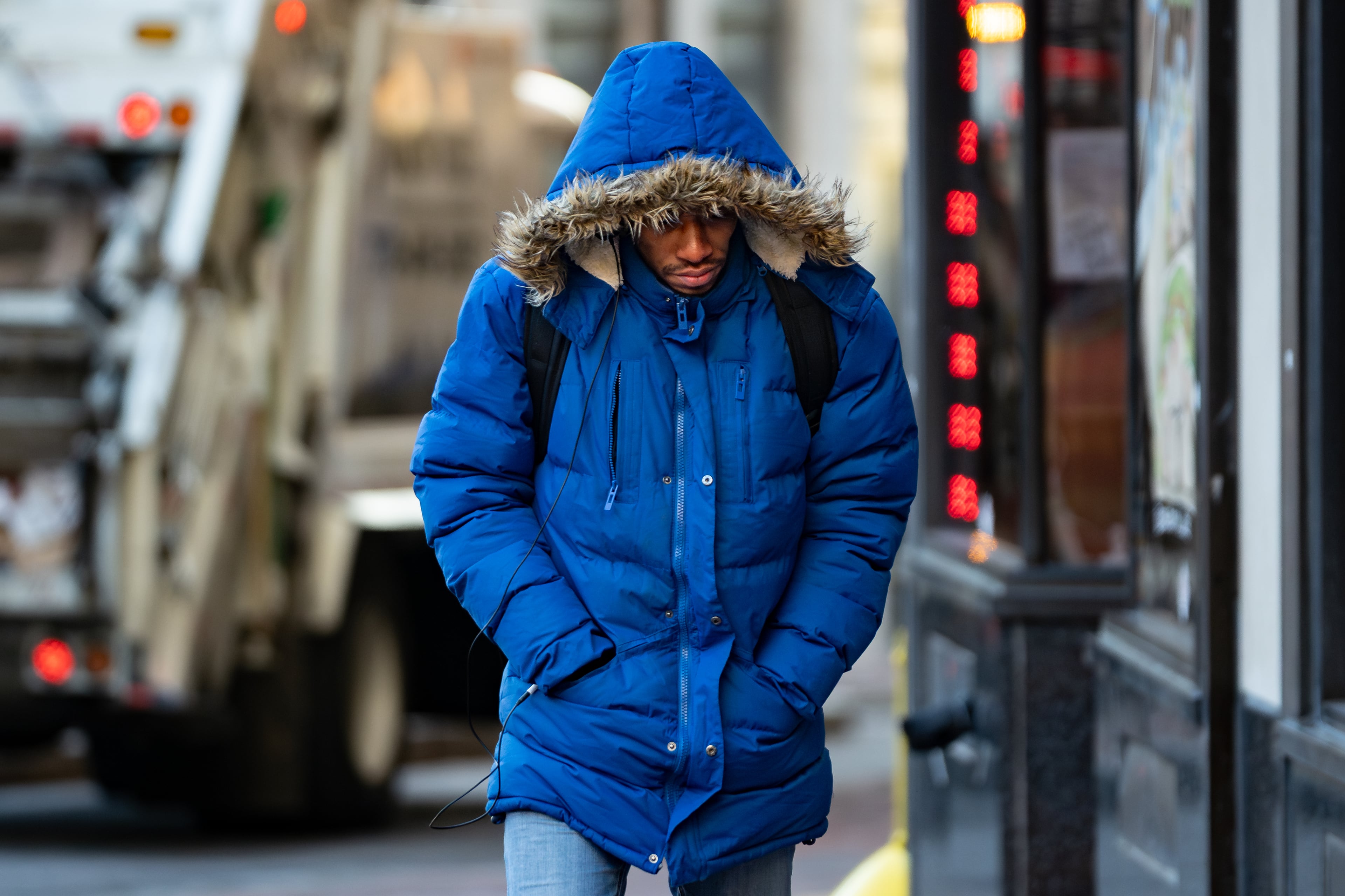 A man walks up the sidewalk by Hurt Plaza amid Tuesday's sub-freezing weather in downtown Atlanta on Jan. 27, 2026. Frigid temperatures will continue through the weekend. (Ben Hendren for the AJC)