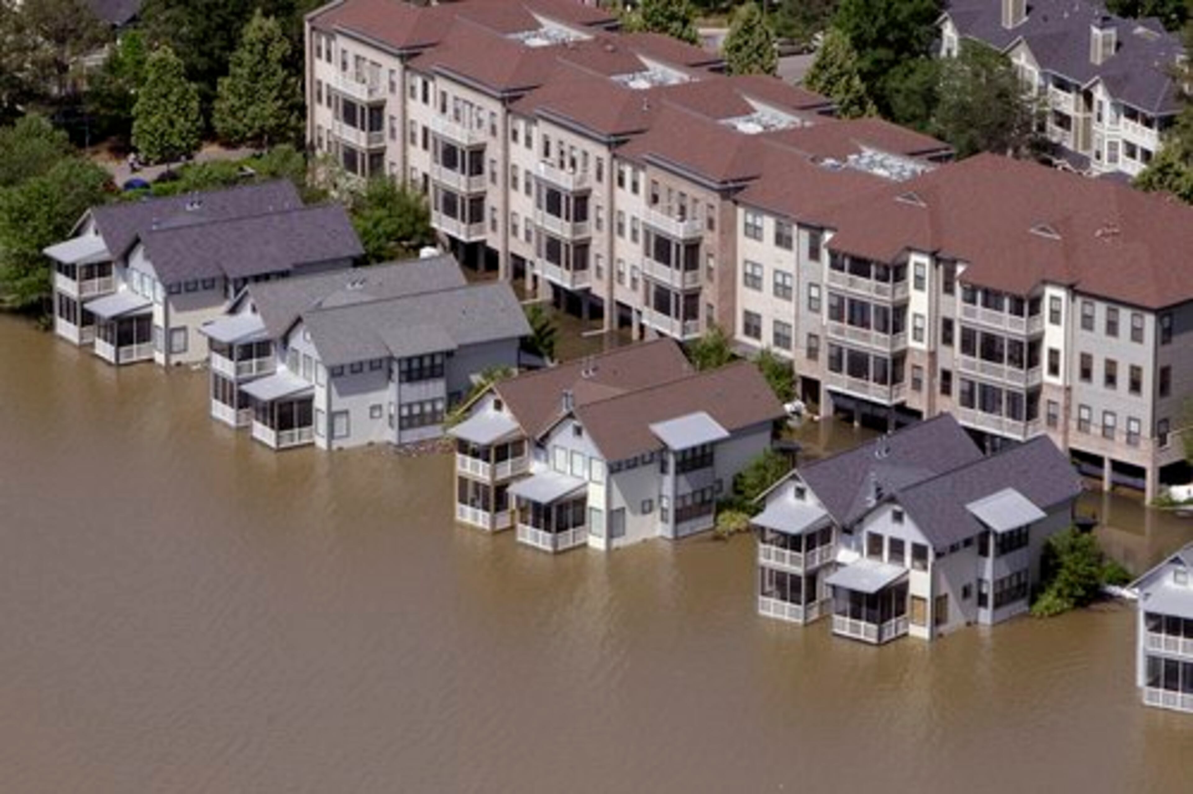 Homes on Mud Island sit in floodwater Tuesday in Memphis. The Mississippi River crested in Memphis at nearly 48 feet on Tuesday, falling short of its all-time record but still soaking low-lying areas with enough water to require a massive cleanup.