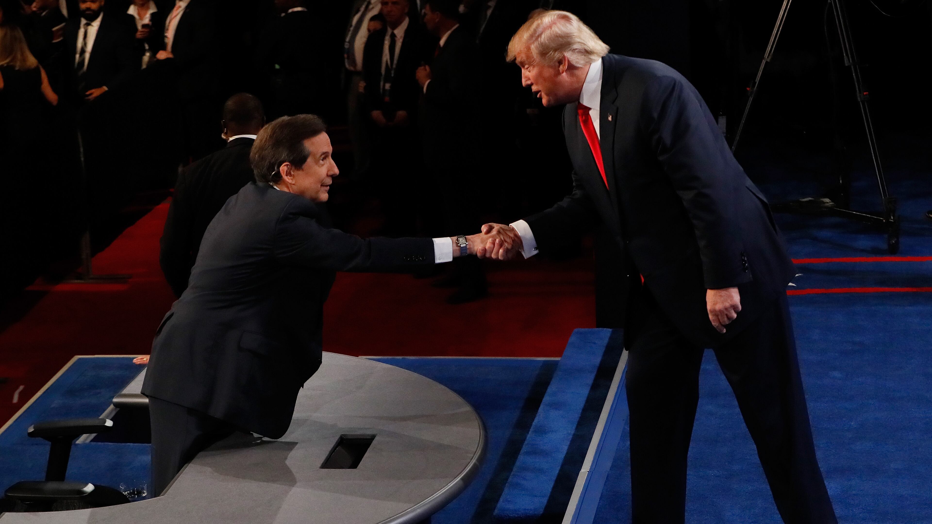 Republican presidential nominee Donald Trump shakes hands with Fox News anchor and moderator Chris Wallace after the third U.S. presidential debate in Las Vegas last week. Mark Ralston-Pool/Getty Images