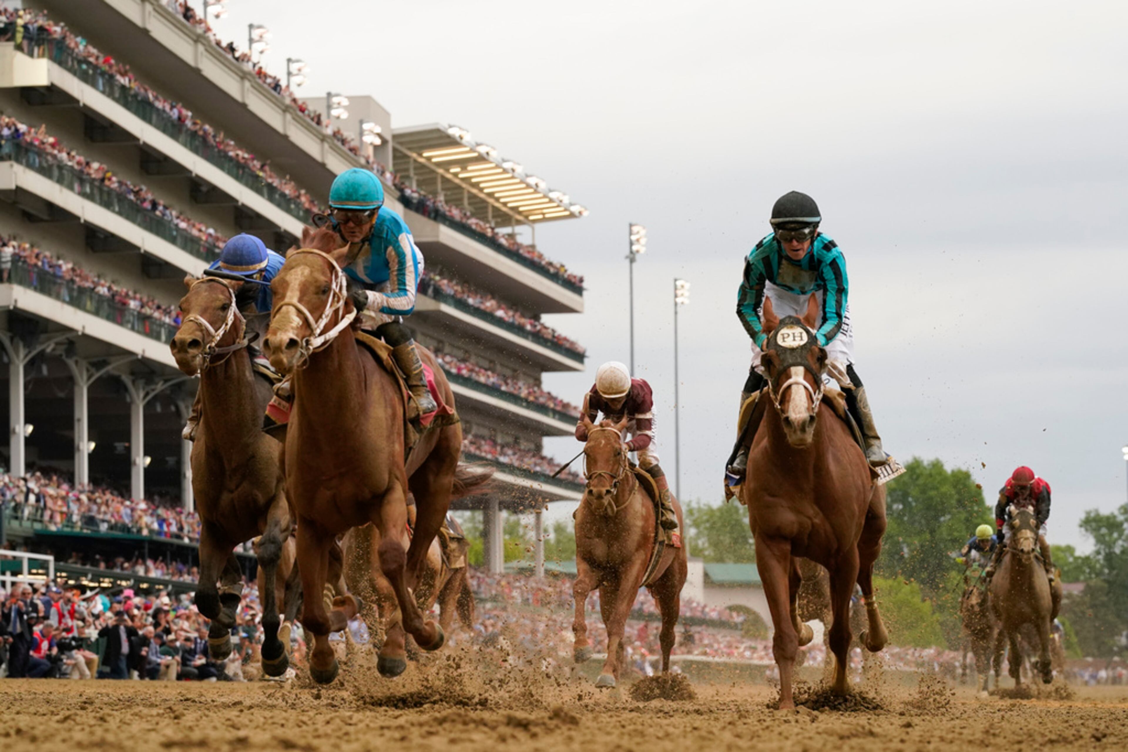 Mage, second from left, with Javier Castellano aboard, wins the 149th running of the Kentucky Derby horse race at Churchill Downs Saturday, May 6, 2023, in Louisville, Ky. (AP Photo/Jeff Roberson)