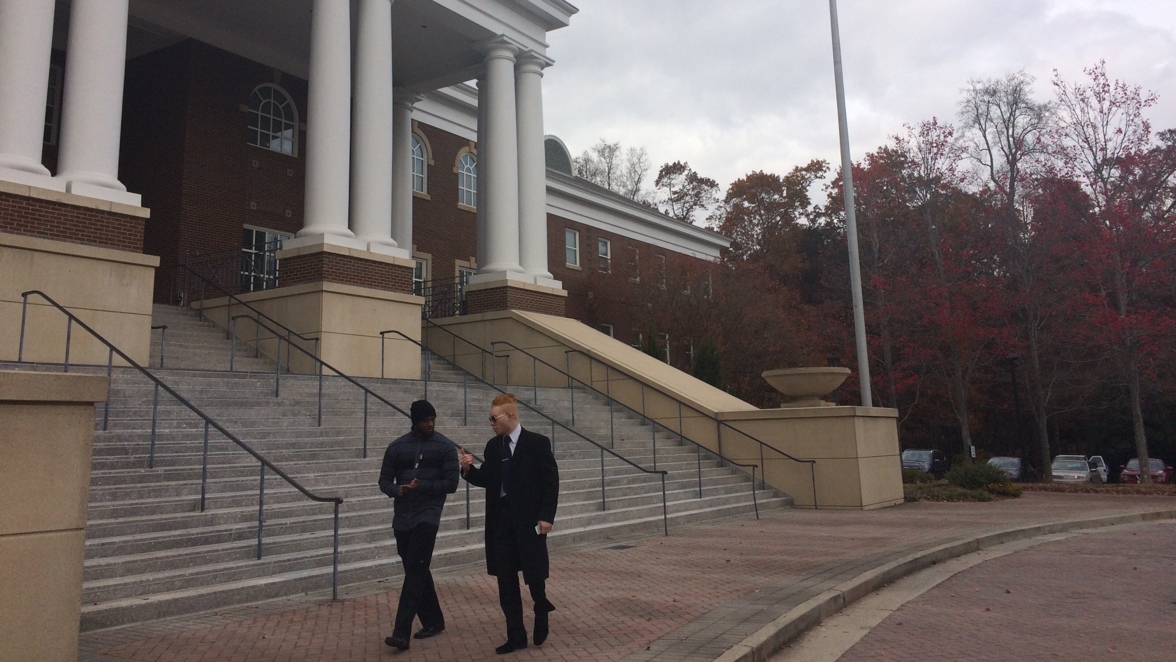 Black Lives Matter Great Atlanta activists walk in front of Roswell City Hall after a meeting.
