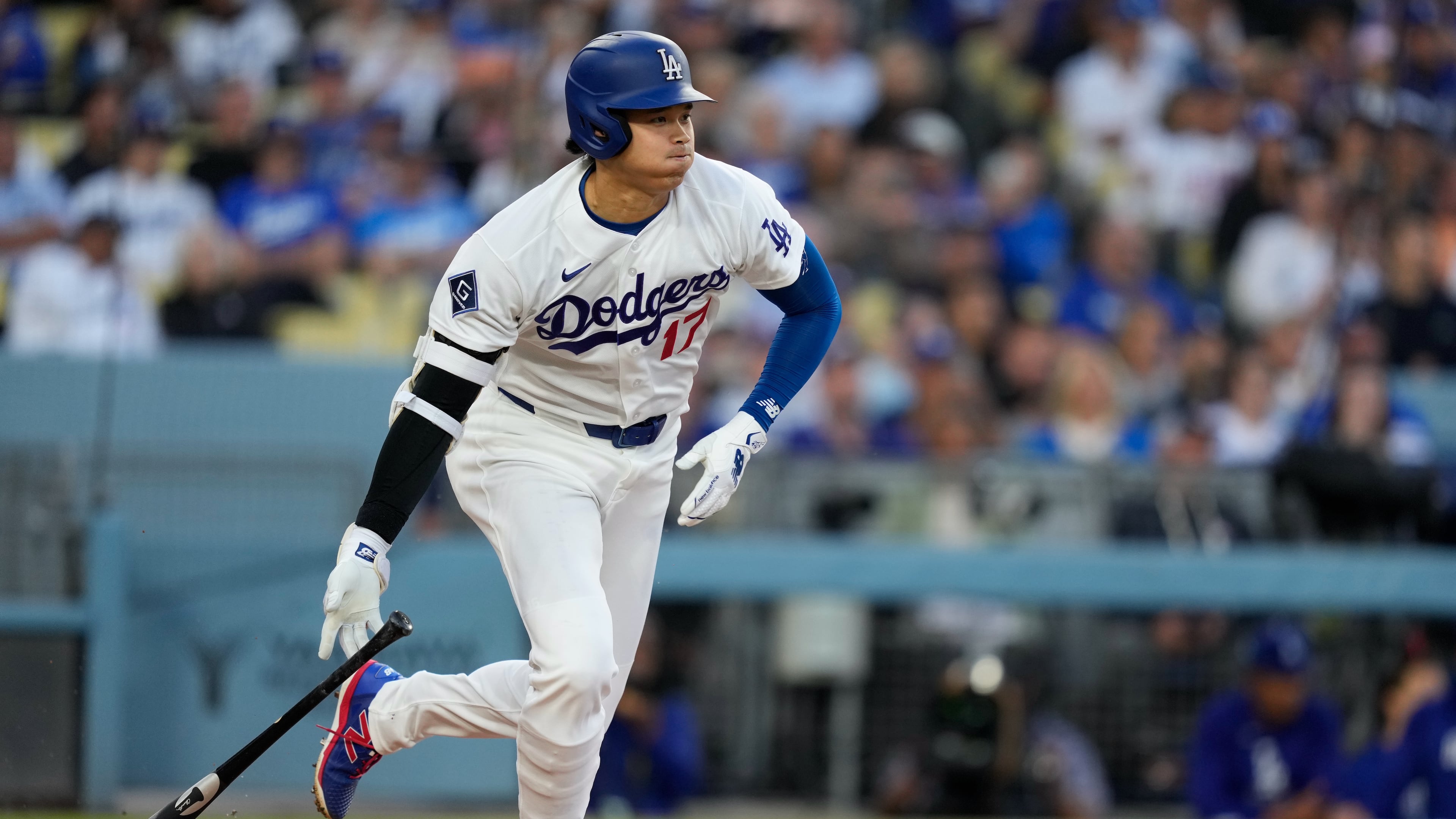 Los Angeles Dodgers' Shohei Ohtani heads to first for a single during the first inning of a baseball game against the Los Angeles Dodgers, Tuesday, May 12, 2026, in Los Angeles. (AP Photo/Mark J. Terrill)