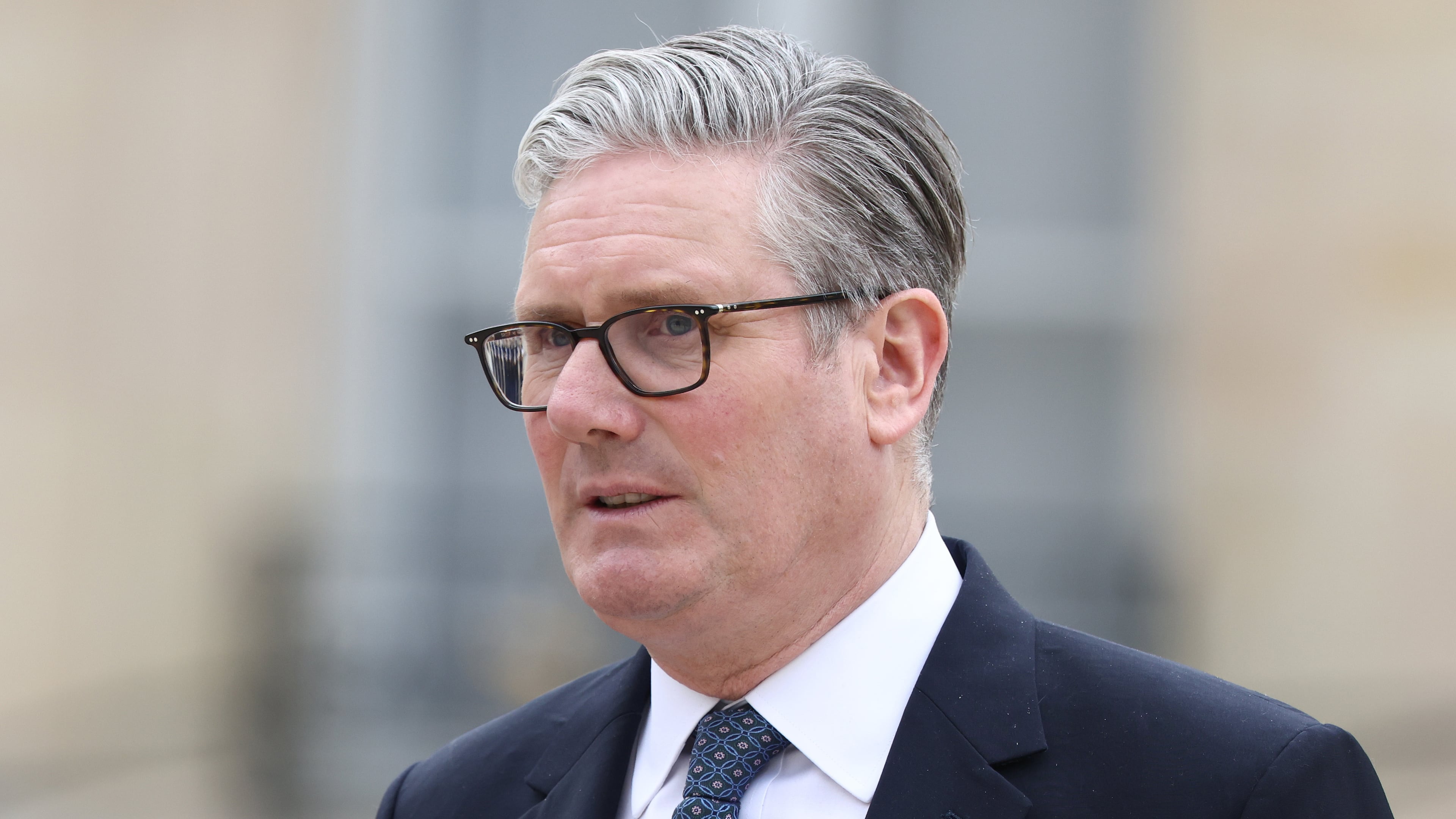 British Prime Minister Keir Starmer leaves after the multinational virtual summit and press conference at the Elysee Presidential Palace in Paris, Friday April 17, 2026 (Tom Nicholson/Pool Photo via AP)