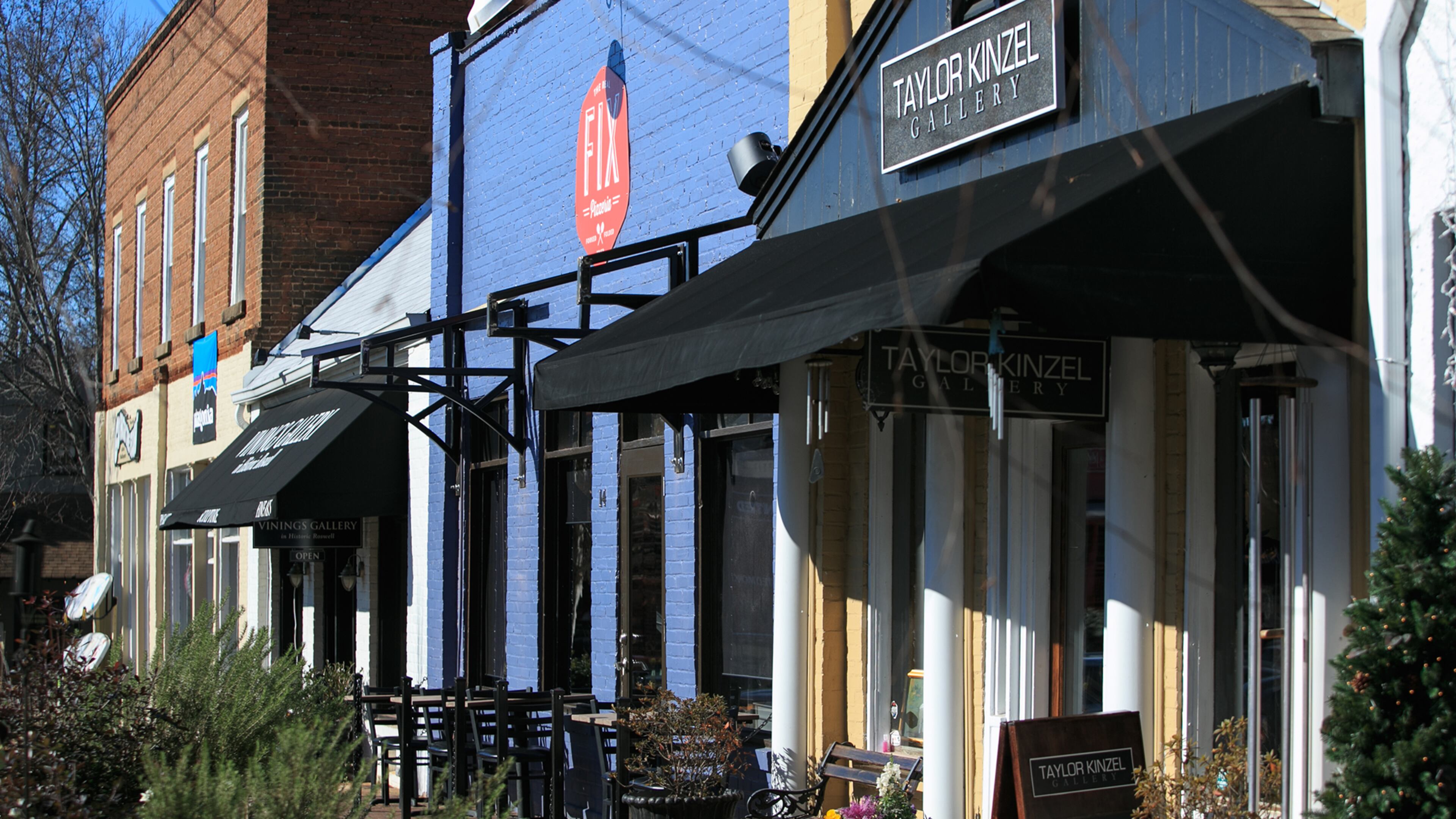 A group of shops and restaurants are shown at the intersection of Elizabeth Way and Canton Street