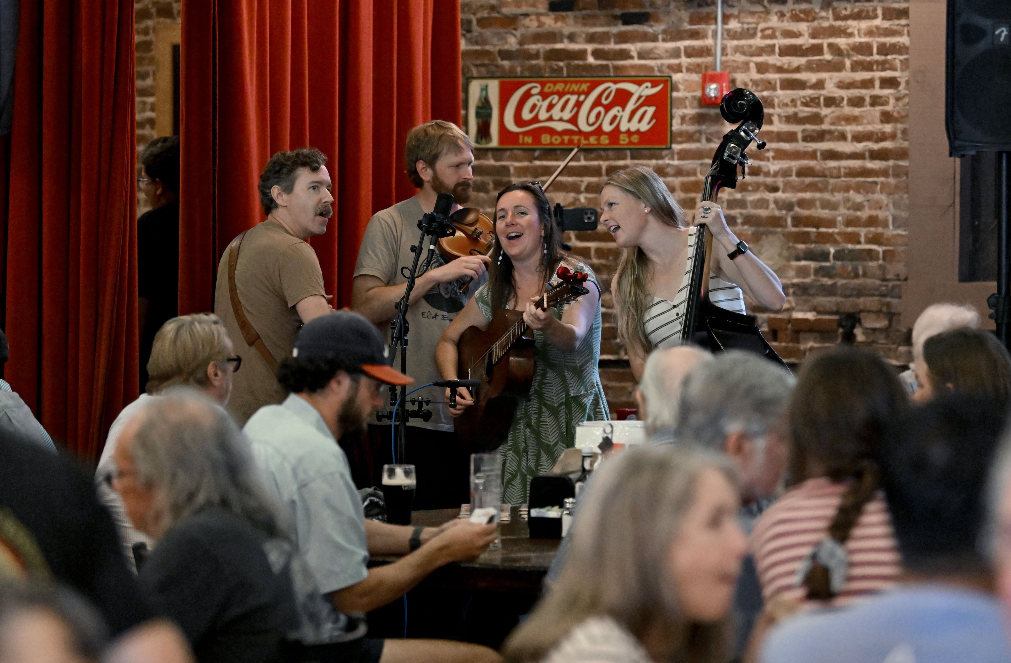 The Four O’Clocks perform during Manuel’s Tavern’s 70th anniversary celebration. (Hyosub Shin/AJC)