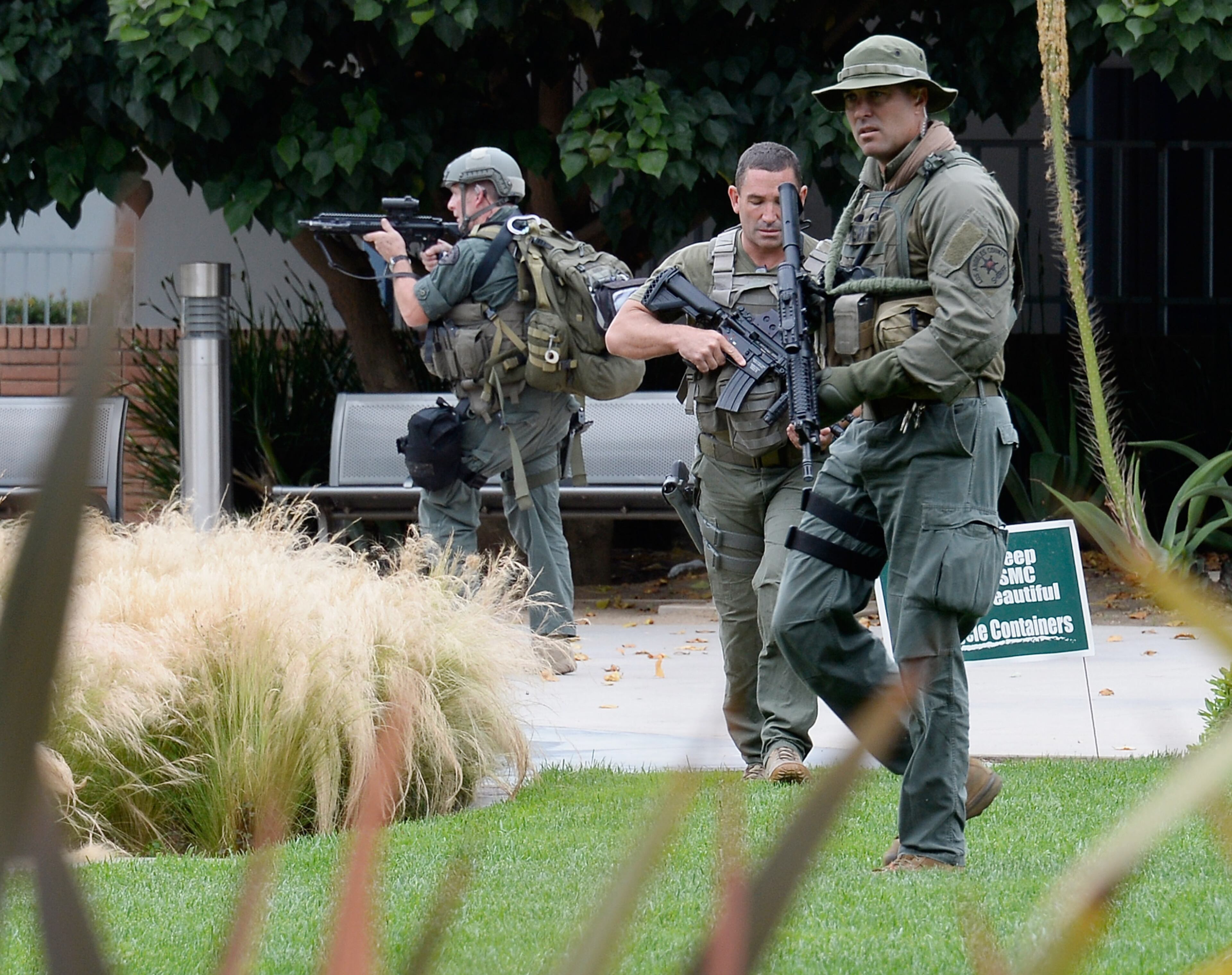 SANTA MONICA, CA - JUNE 07: Los Angeles County SWAT team members search the grounds of Santa Monica College near the library after multiple shootings were reported on the campus June 7, 2013 in Santa Monica, California. According to reports, at least three people have been injured, and a suspect was taken into custody. (Photo by Kevork Djansezian/Getty Images)