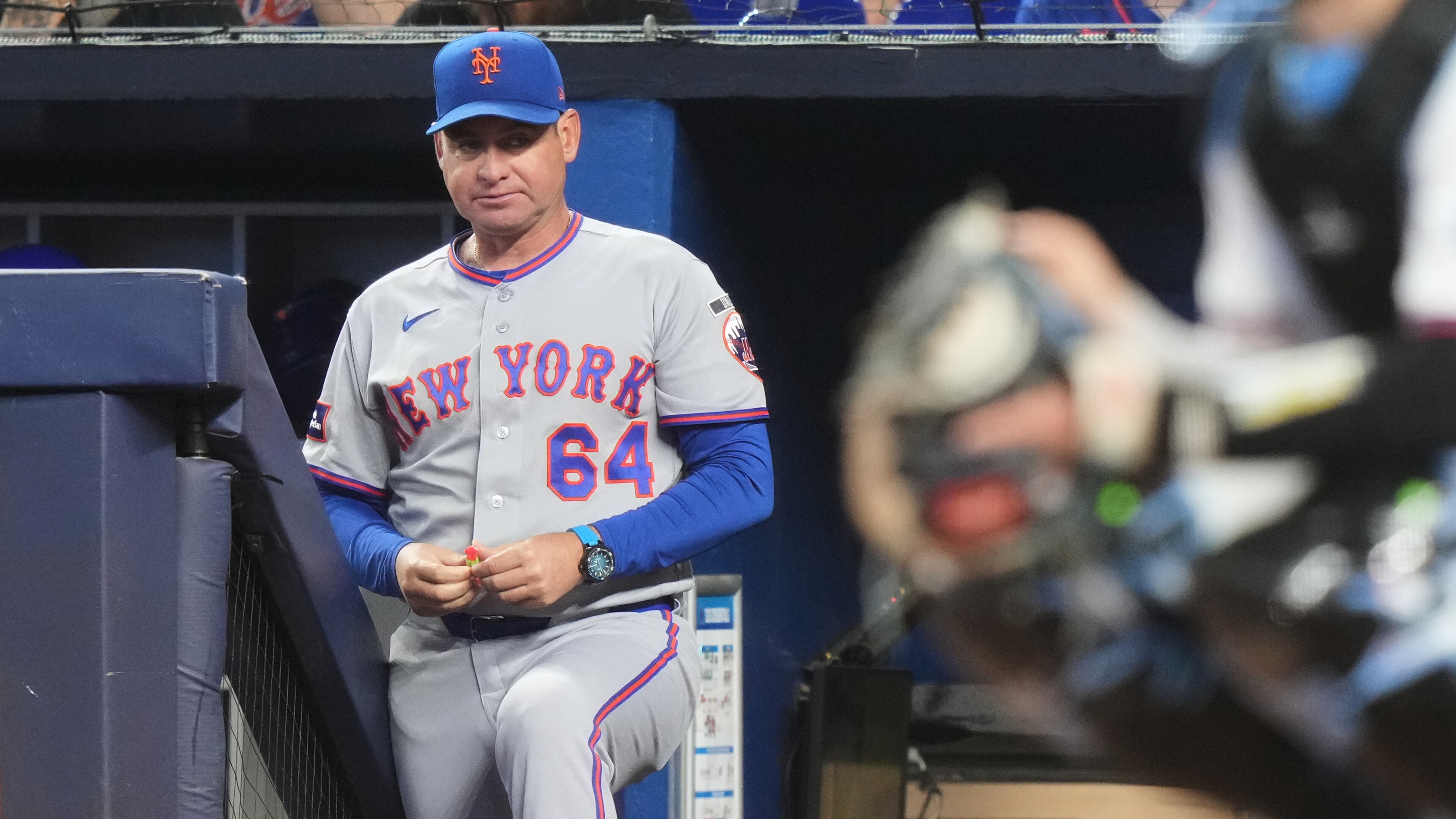 FILE - New York Mets manager Carlos Mendoza (64) watches during the first inning of a baseball game against the Miami Marlins, Saturday, May 23, 2026, in Miami. (AP Photo/Lynne Sladky, File)