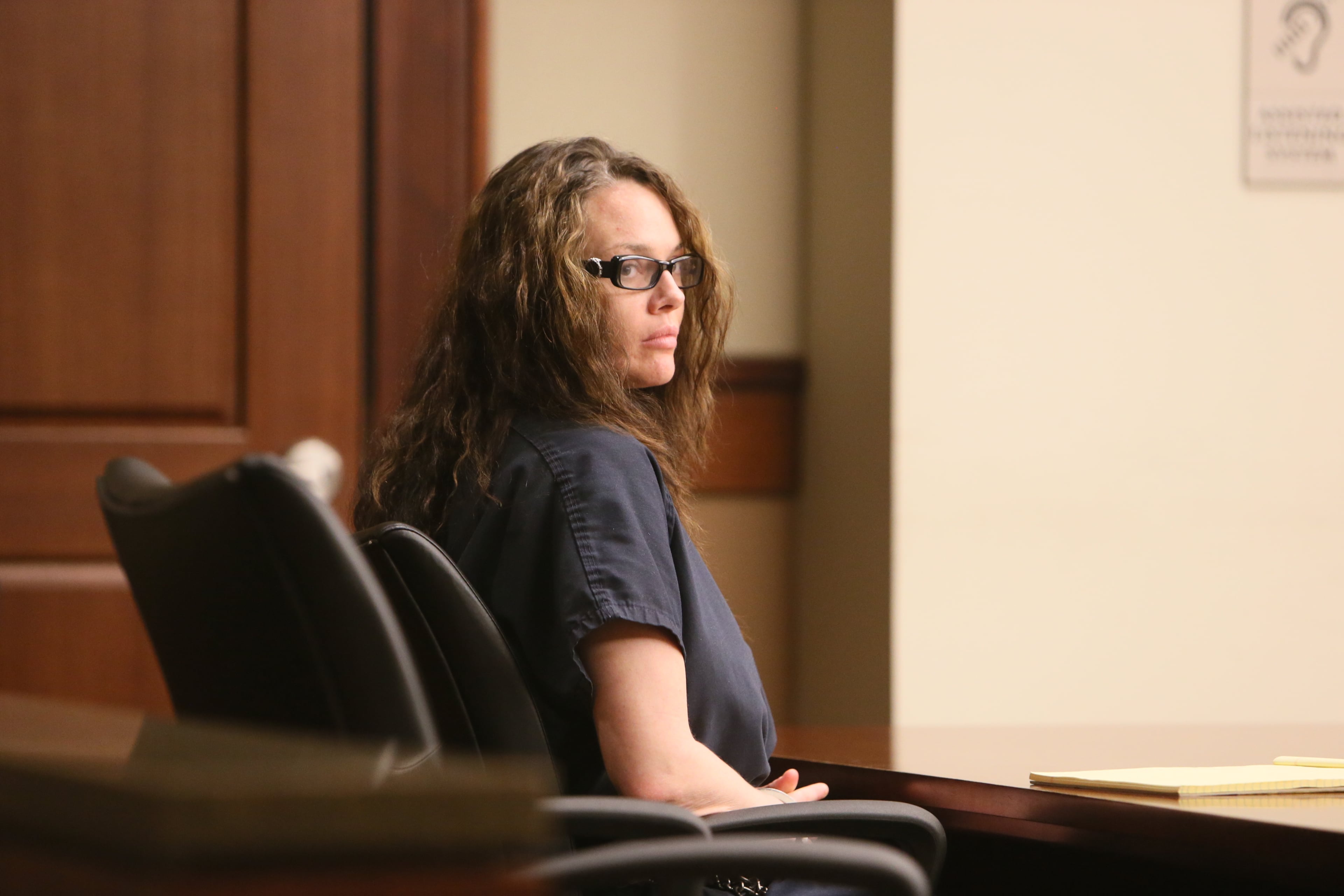 In a navy jail suit, Anna Benson, 37, sat quietly Thursday afternoon in Cobb County Superior Court as her attorney asked Judge LaTain Kell to grant $50,000 bond, along with numerous stipulations, including psychological evaluation and treatment. Benson has been in jail since July 7, when she was arrested after allegedly threatening her husband, armed with several weapons, at his Smyrna home.