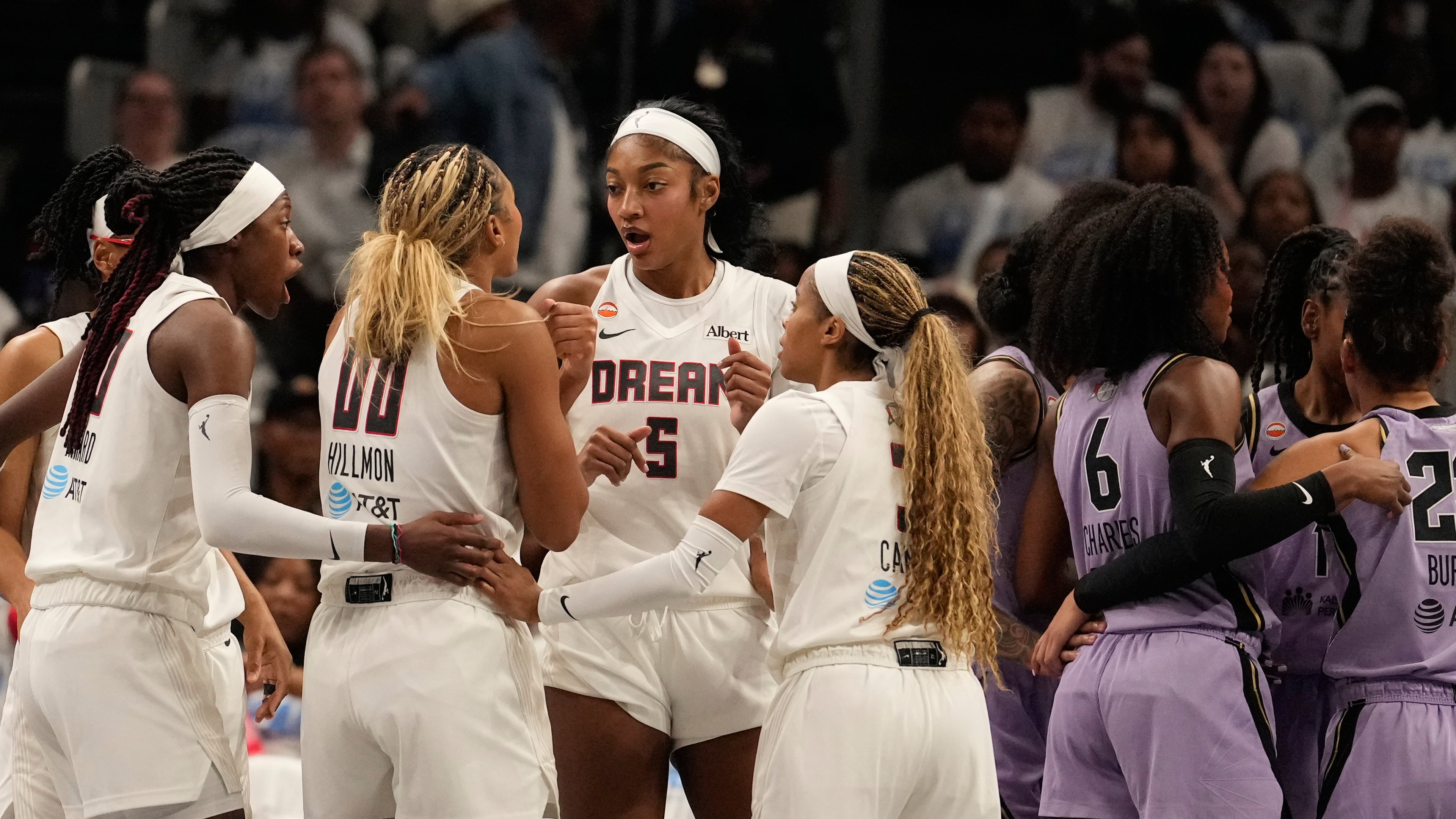 Atlanta Dream forward Angel Reese (5) and teammates talk on the court during Game 4 of the WNBA basketball finals against the Golden State Valkyries on Saturday, Oct. 24, 2026, in Atlanta. (AP Photo/Brynn Anderson)