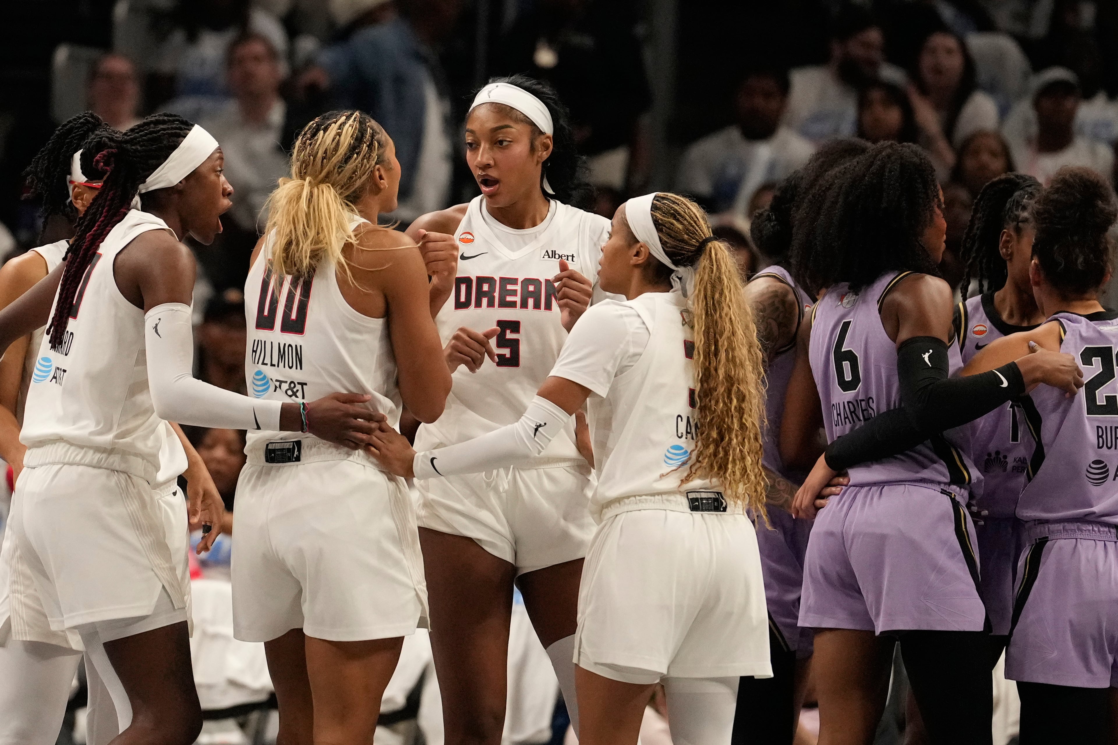 Atlanta Dream forward Angel Reese (5) and teammates talk on the court during Game 4 of the WNBA basketball finals against the Golden State Valkyries on Saturday, Oct. 24, 2026, in Atlanta. (AP Photo/Brynn Anderson)