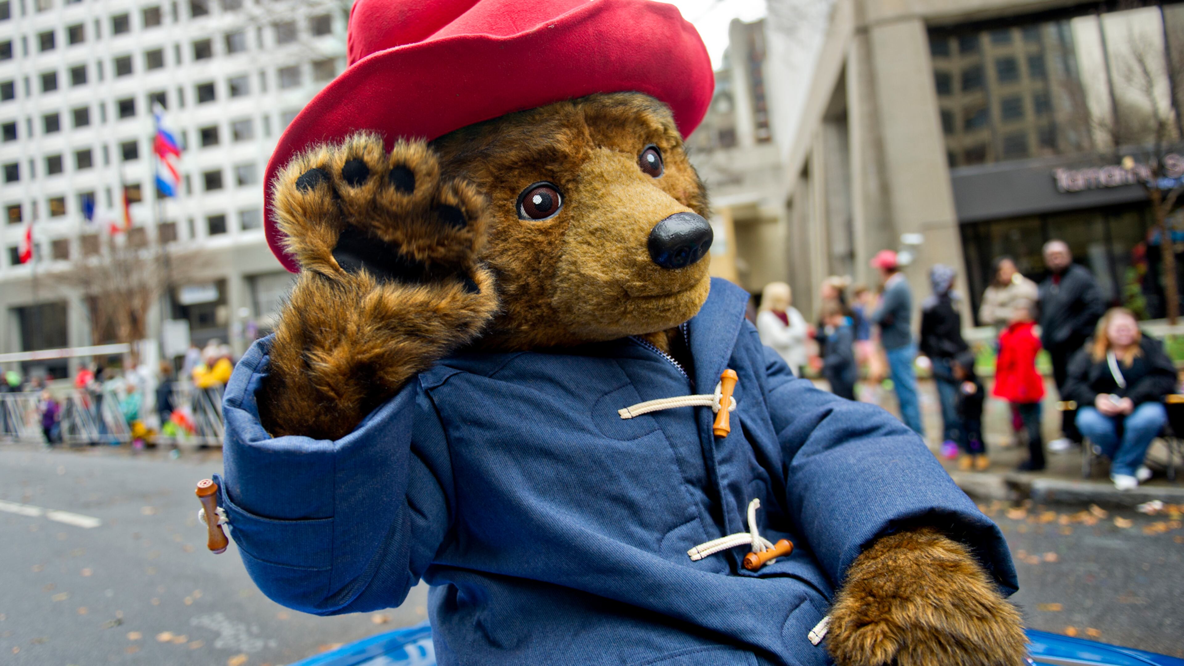 December 6, 2014 Atlanta - Paddington Bear waves to the crowd during the 2014 Children's Christmas Parade in Atlanta on Saturday, December 6, 2014. Thousands of people braved the inclement weather to watch the parade as it made its way down Peachtree St. JONATHAN PHILLIPS / SPECIAL