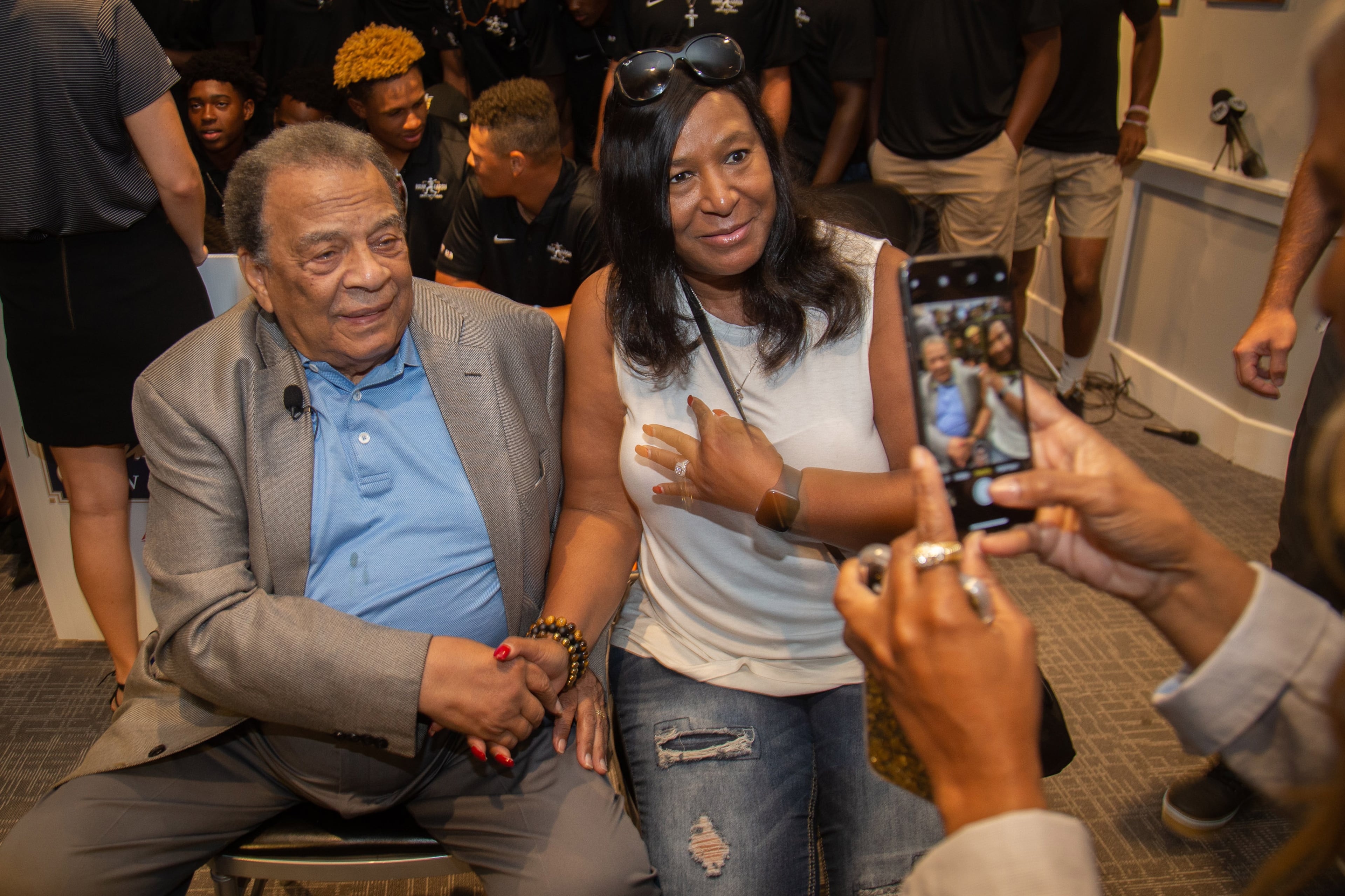 Andrew Young poses for a photo with the participants at the end of the Hank Aaron Invitational at SunTrust Park in Atlanta August 2, 2019. STEVE SCHAEFER / SPECIAL TO THE AJC