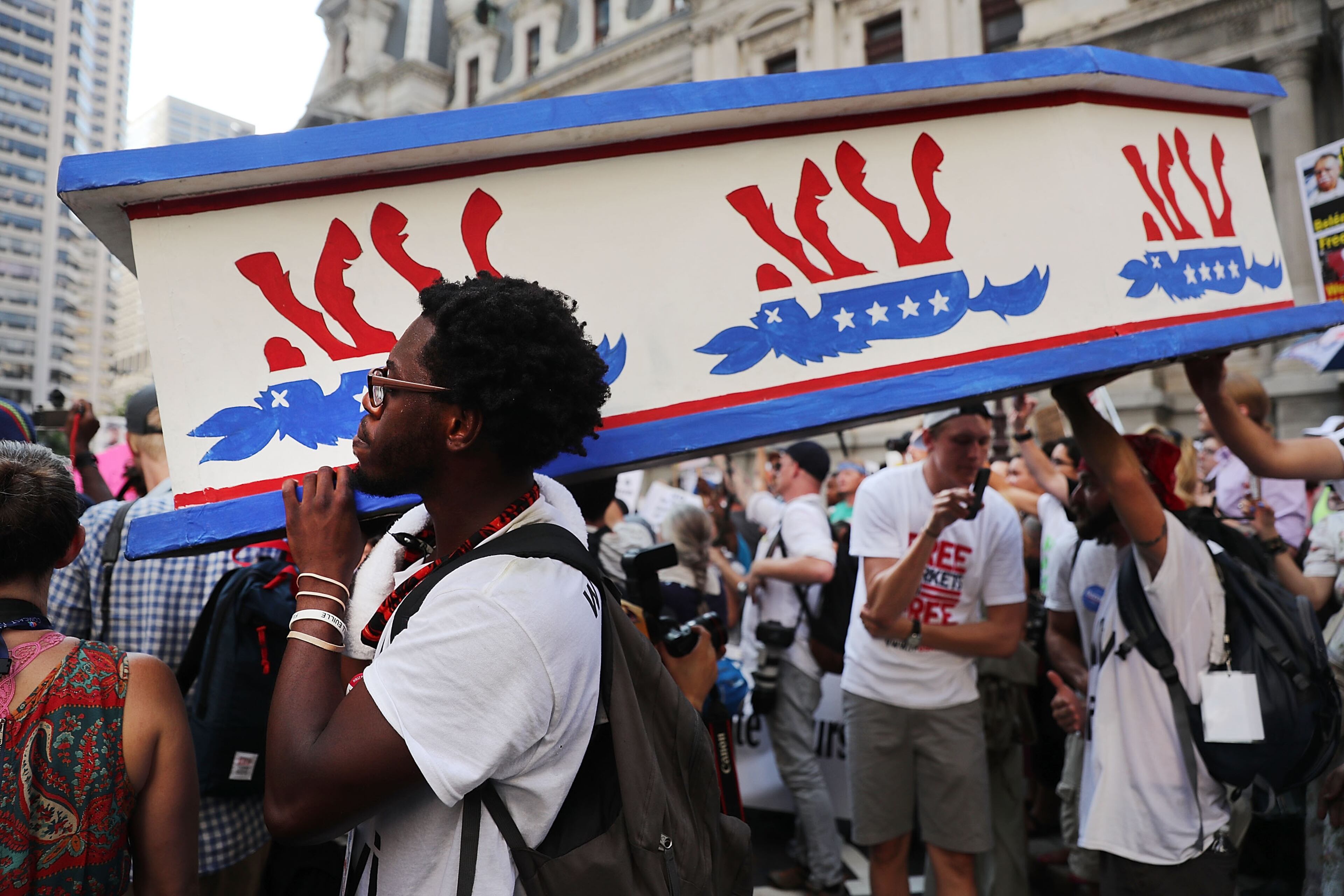 Black Lives Matter protesters hold a wooden coffin with an upside down donkey representing the Democratic party in downtown Philadelphia during the Democratic National Convention (DNC) on July 26, 2016 in Philadelphia, Pennsylvania. (Photo by Spencer Platt/Getty Images)