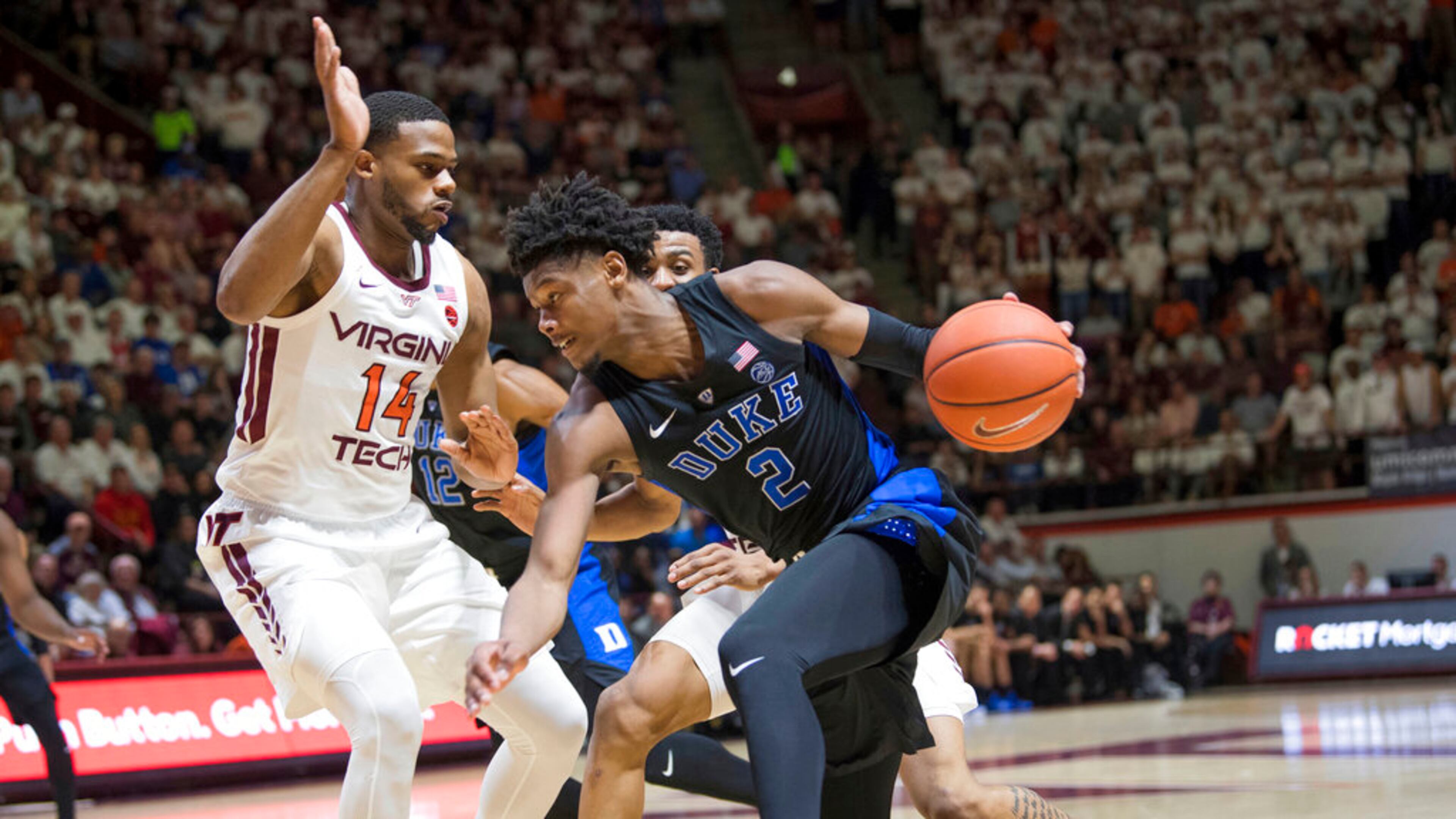 Virginia Tech's P.J. Horne (left) defends against Duke forward Cam Reddish (2) on Feb. 26, 2019. (AP Photo/Lee Luther Jr.)