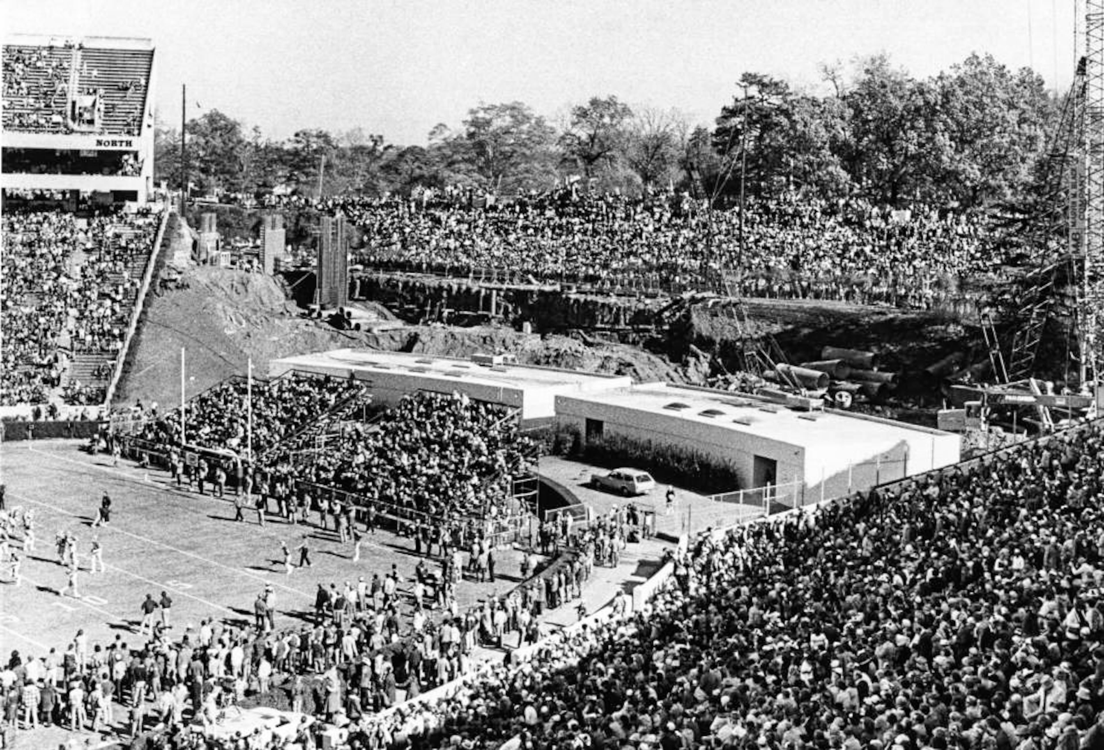 Sanford Stadium's "Track People" watch the Bulldogs from the railroad tracks, 1980.