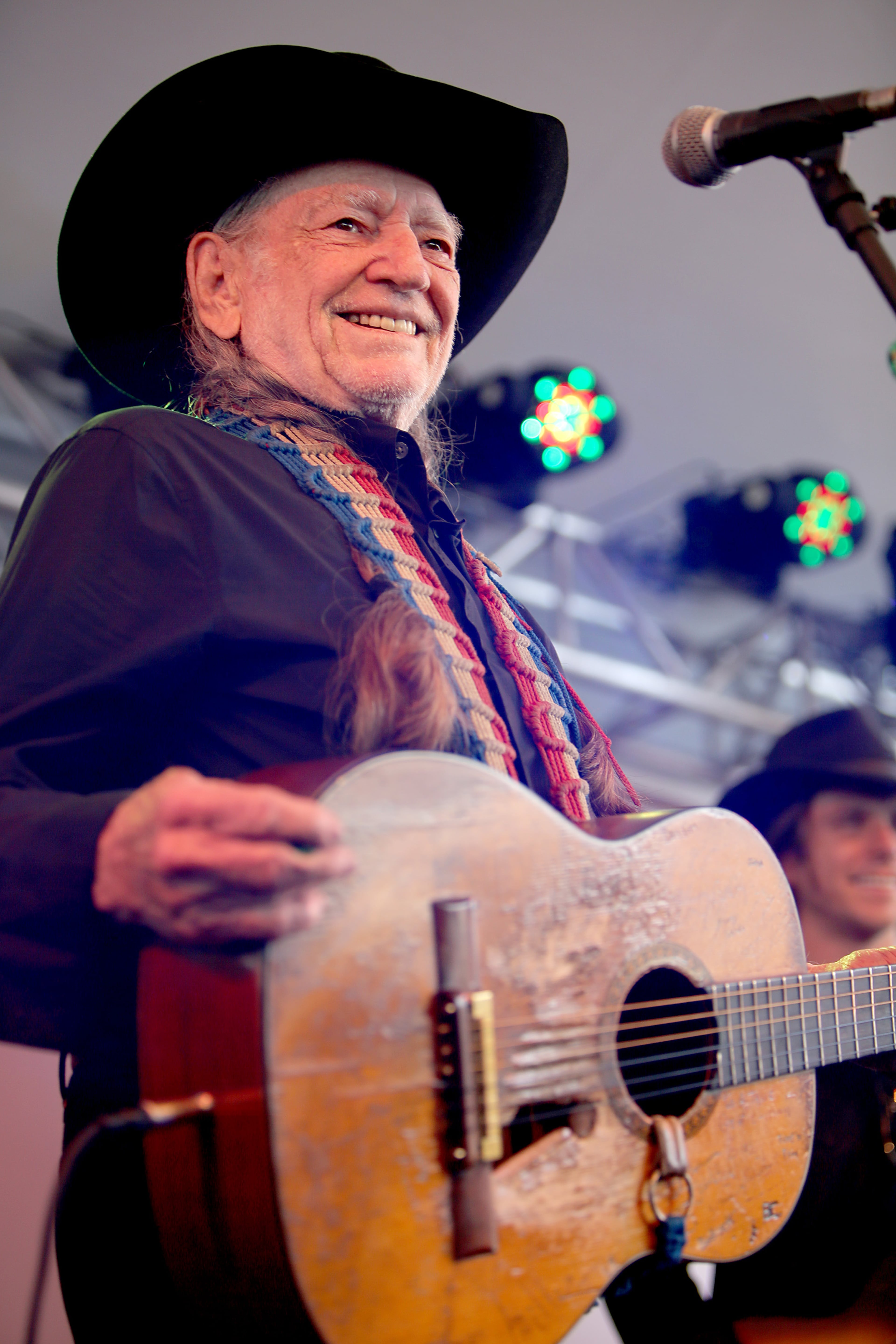 WEST HOLLYWOOD, CA - APRIL 13: Musican Willie Nelson performs at the John Varvatos 11th Annual Stuart House Benefit presented by Chrysler, Kids Tent by by Hasbro at John Varvatos Boutique on April 13, 2014 in West Hollywood, California. (Photo by Rachel Murray/Getty Images for John Varvatos)