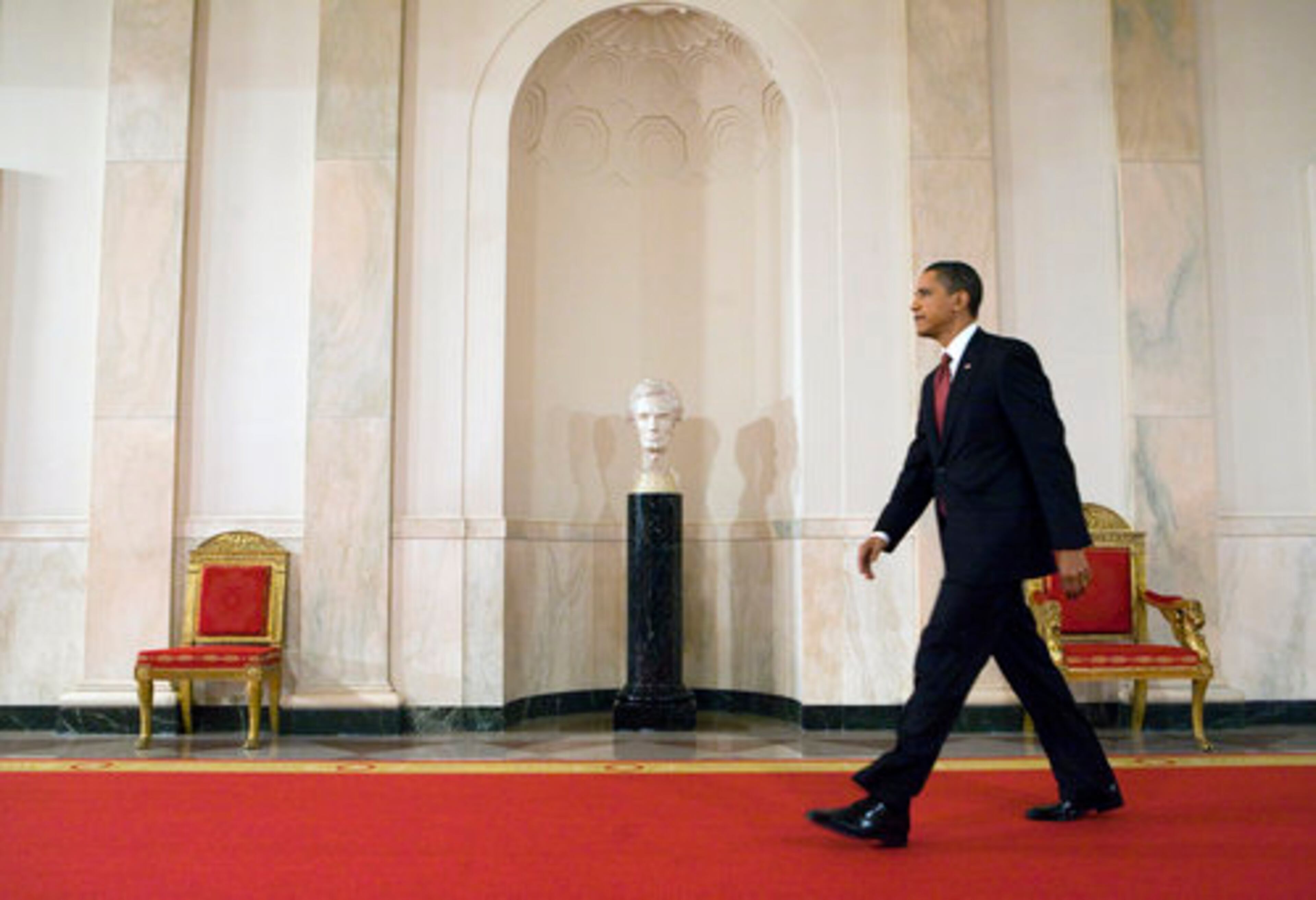 Obama arrives at the news conference at the White House.