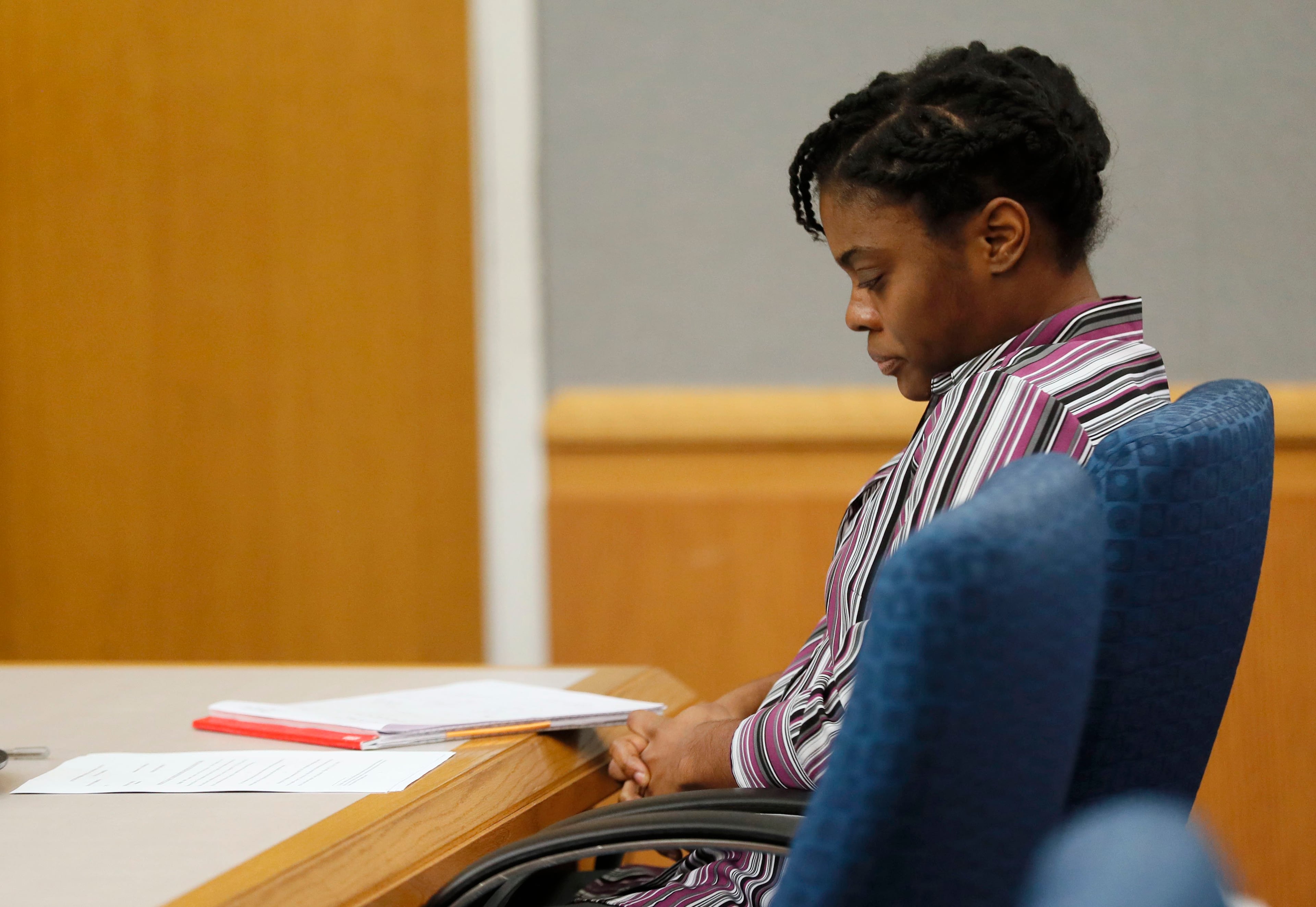 April 25, 2019 - Lawrenceville - Tiffany Moss showed little emotion during the testimony of Emani Moss' father, Eman Moss, at her capital murder trial. Eman Moss agreed to a plea deal that allowed him t avoid the penalty in exchange for testifying against Tiffany Moss. The prosecution continued for the second day in the Tiffany Moss death penalty trial with the testimony of Eman Moss. Moss, who is representing herself, again declined to ask questions of the prosecution witnesses. Bob Andres / bandres@ajc.com