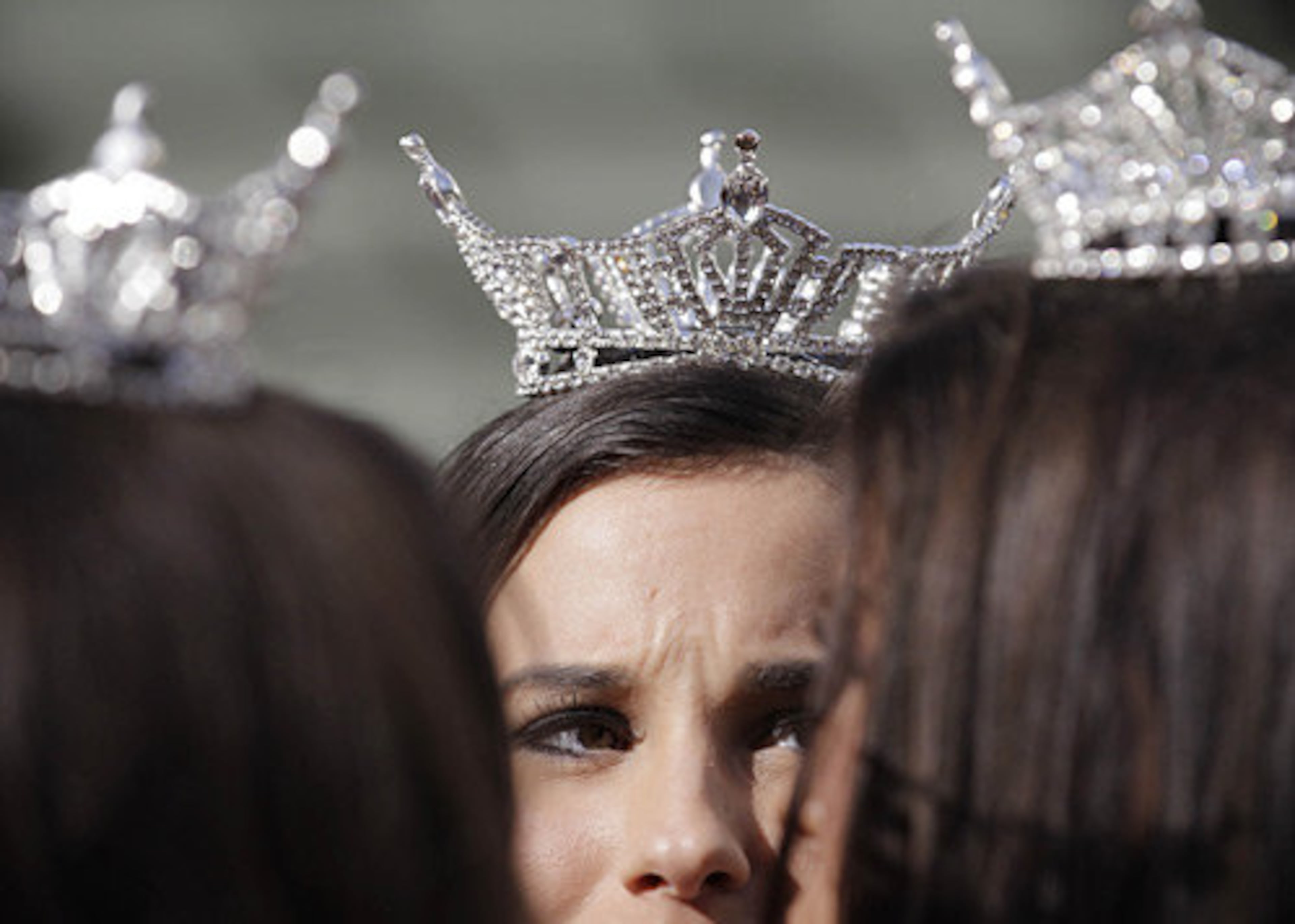 The "Show Us Your Shoes" event started when spectators would catcall Miss America contestants riding past in open-topped cars, asking them to show their shoes. They hoped to embarrass the girls because they wore elaborate dresses but casual shoes since nobody would see their feet. The girls eventually responded by displaying decorated footwear, and shoes eventually became the highlight of their outfits.