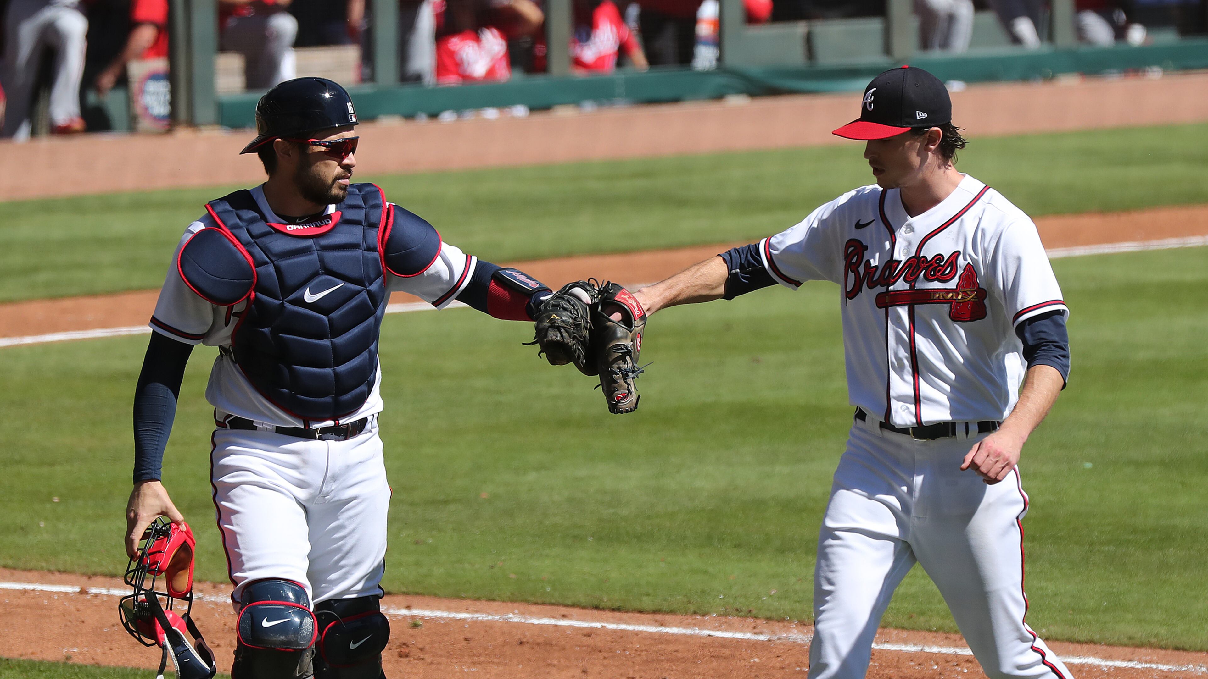 Braves pitcher Max Fried gets a glove bump from catcher Travis d’Arnaud during the sixth inning in Game 1 of the National League wild card playoff series on Wednesday, Sept. 30, 2020 in Atlanta. Curtis Compton / Curtis.Compton@ajc.com
