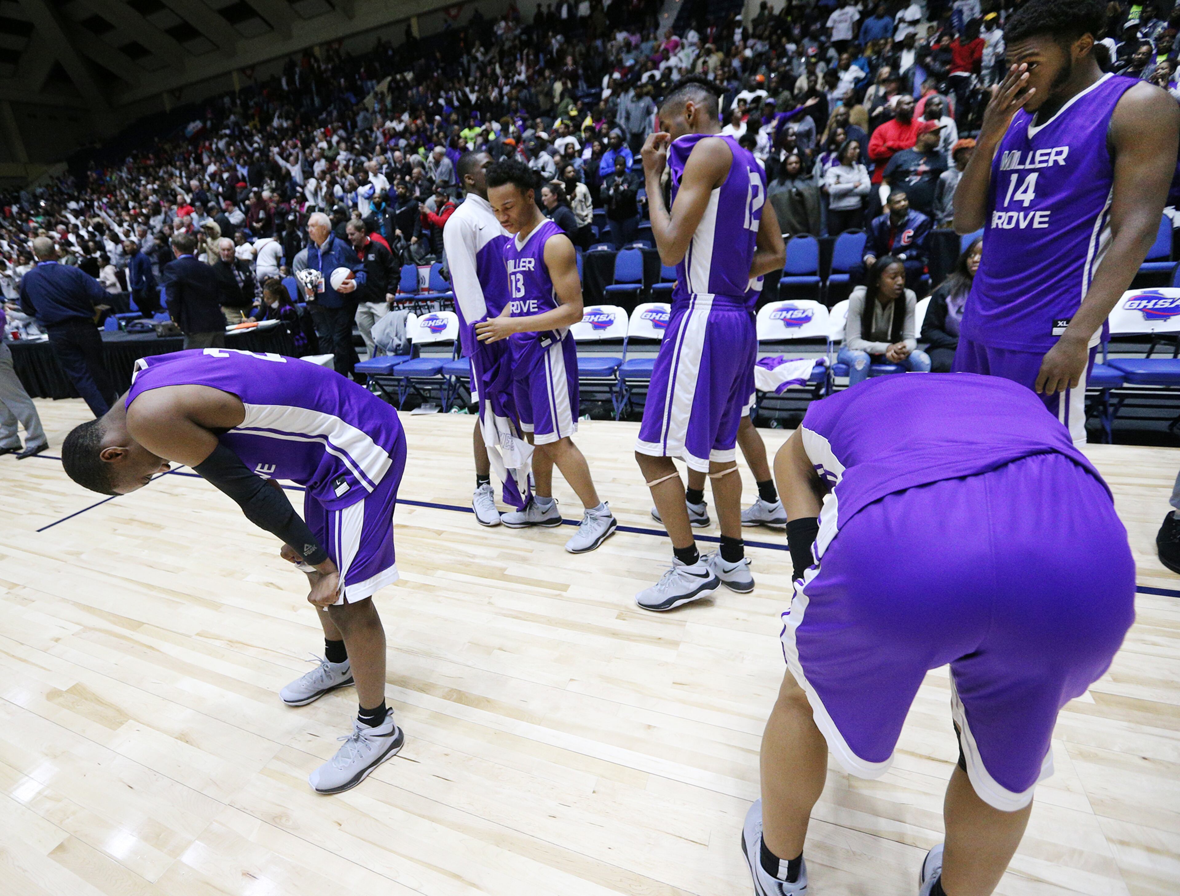 March 8, 2018 Macon: Miller Grove players react after falling to Warner Robins 67-64 in their GHSA state basketball championship game on Thursday, March 8, 2018, in Macon. Curtis Compton/ccompton@ajc.com