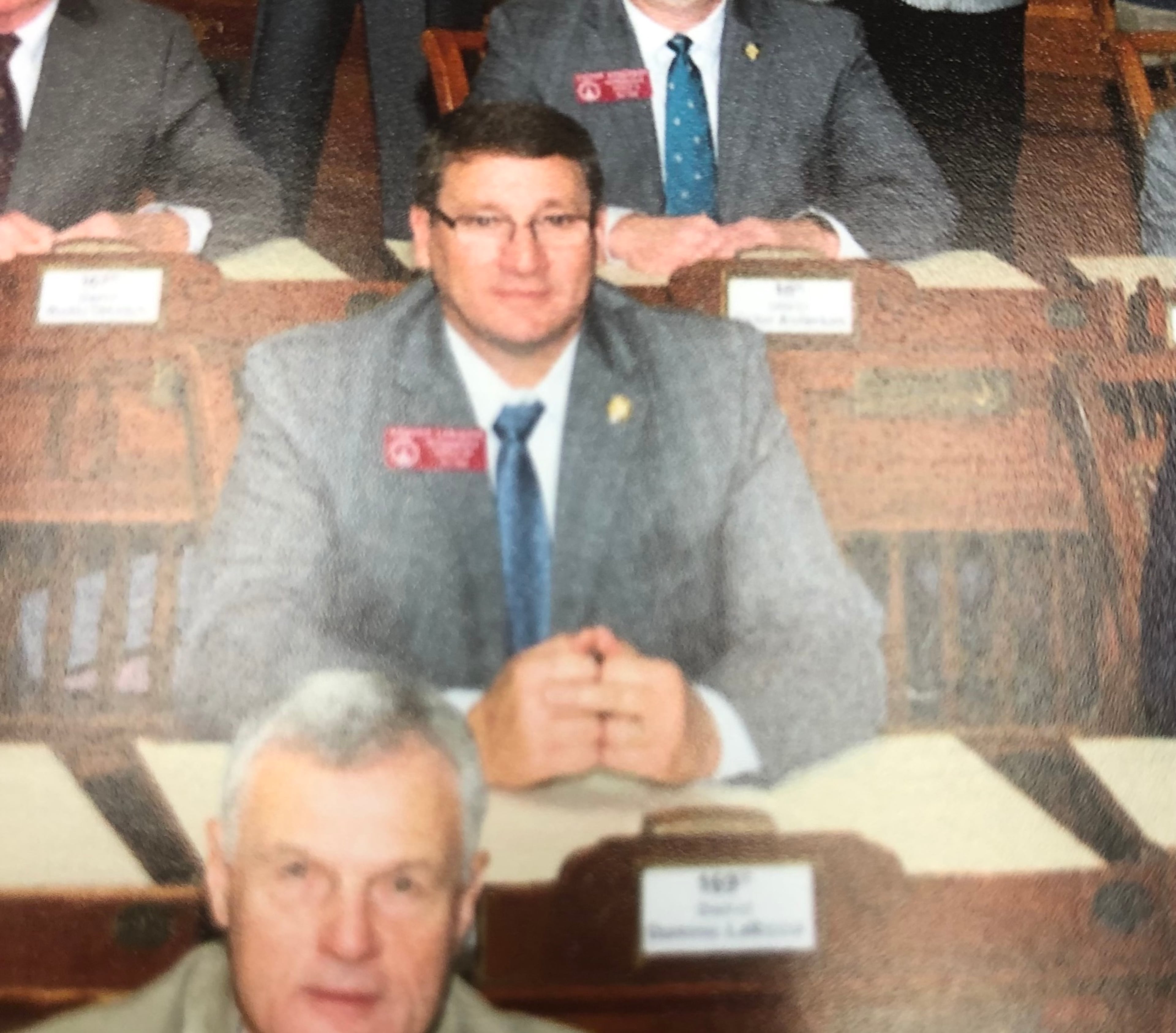 State Rep. Dominic LaRiccia puts his middle finger in a choice position in the annual House gallery photo.