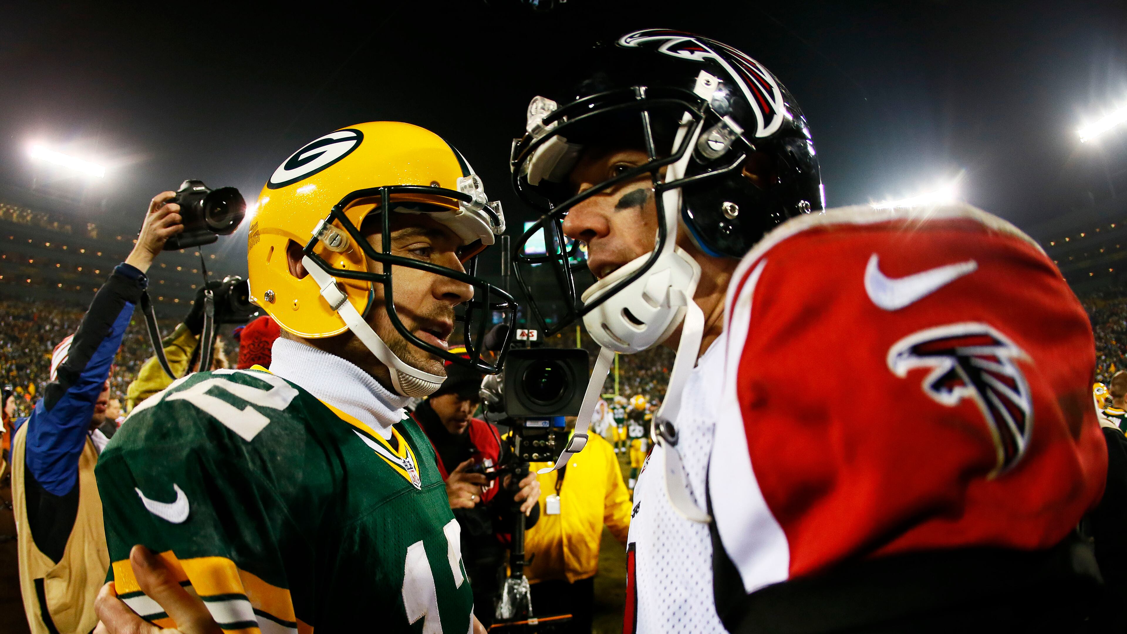 Green Bay's Aaron Rodgers and the Falcons Matt Ryan are pretty much head-to-head in late-season performance. (Kevin C. Cox/Getty Images)