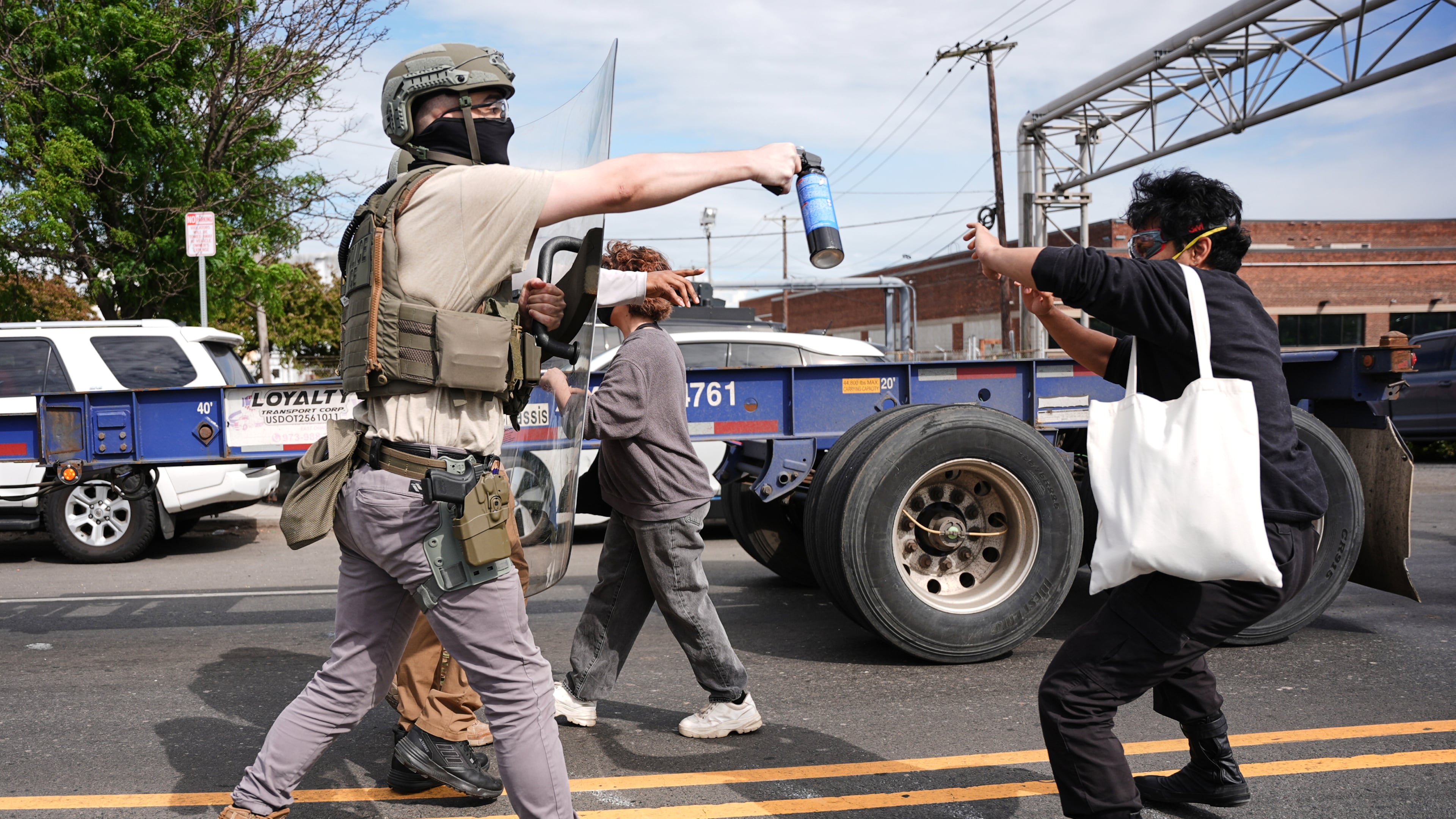 Federal immigration officers confront protesters outside the Delaney Hall detention center Thursday, May 28, 2026, in Newark, N.J. (AP Photo/Angelina Katsanis)